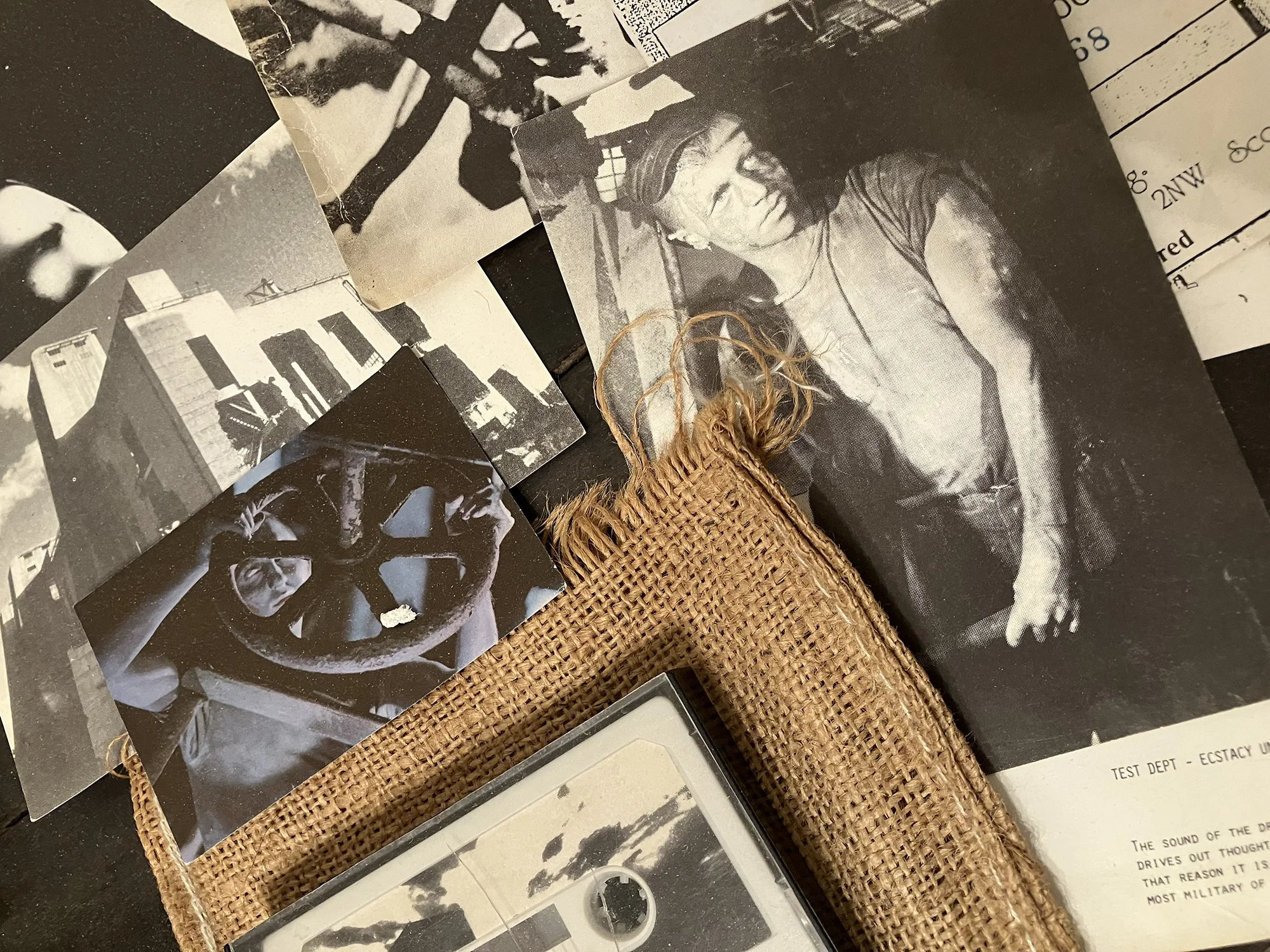 Test Dept.
“ecstacy under duress,”
Pleasantly Surprised, # 168 of 1000
1984, burlap, postcards, cassette tape, various dimensions