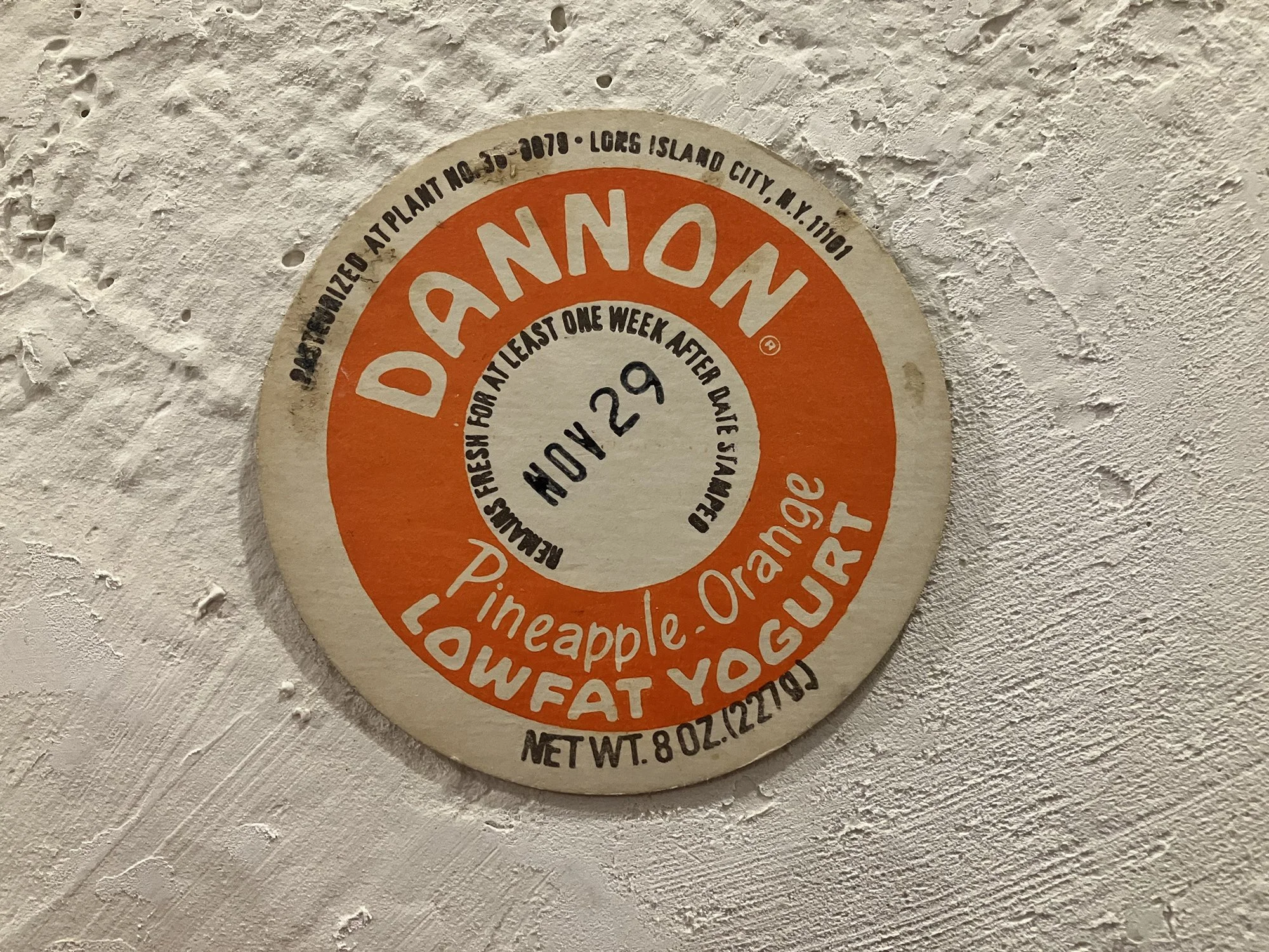 Dannon Yogurt top,
Michael Crewdson Collection, Park Slope, Brooklyn, 1980-82,  cardboard, ink, each 2 3⁄4 inches in diameter