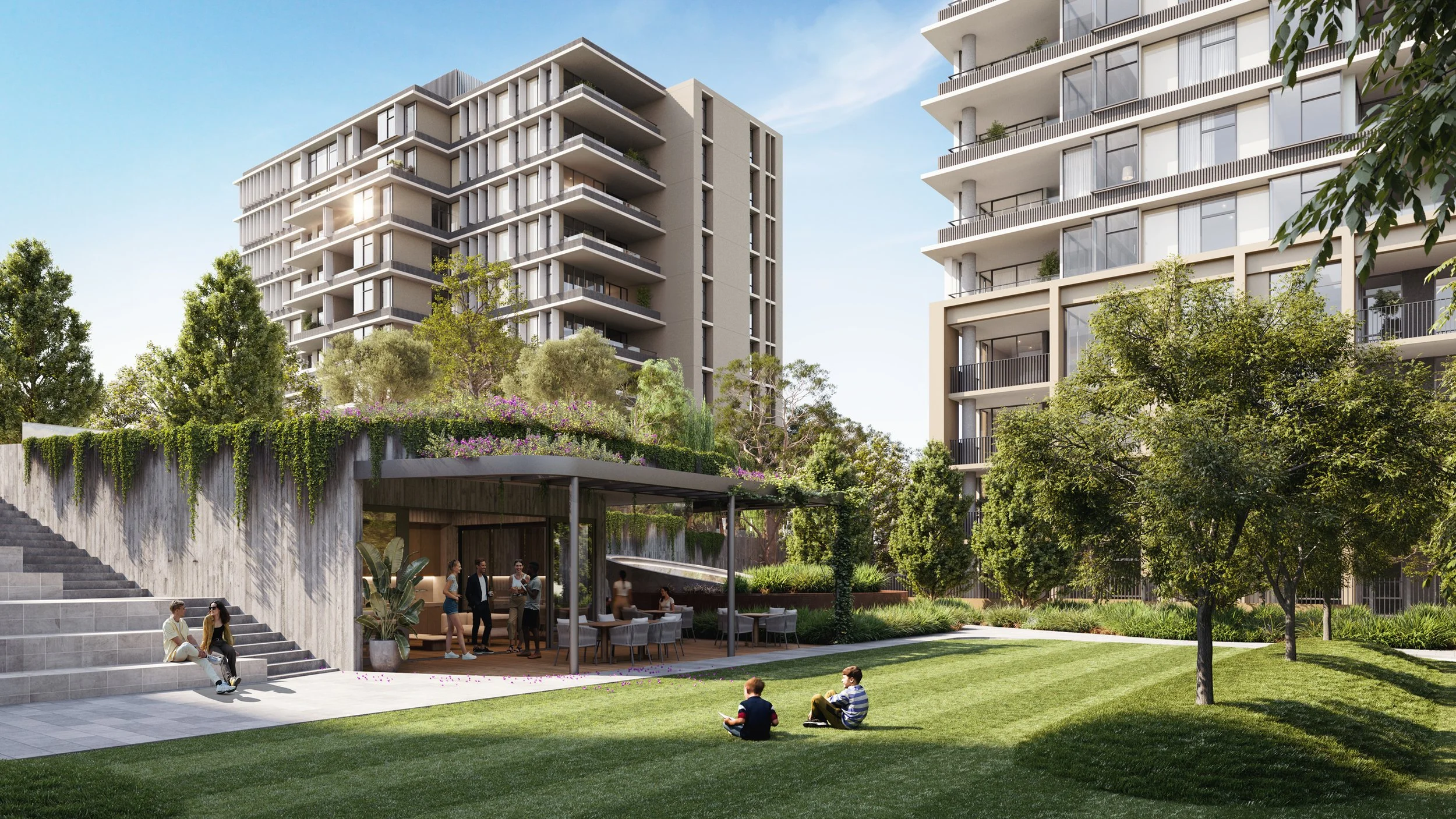 Modern residential complex with high-rise buildings, outdoor seating, and children playing on the lawn, surrounded by trees and greenery.