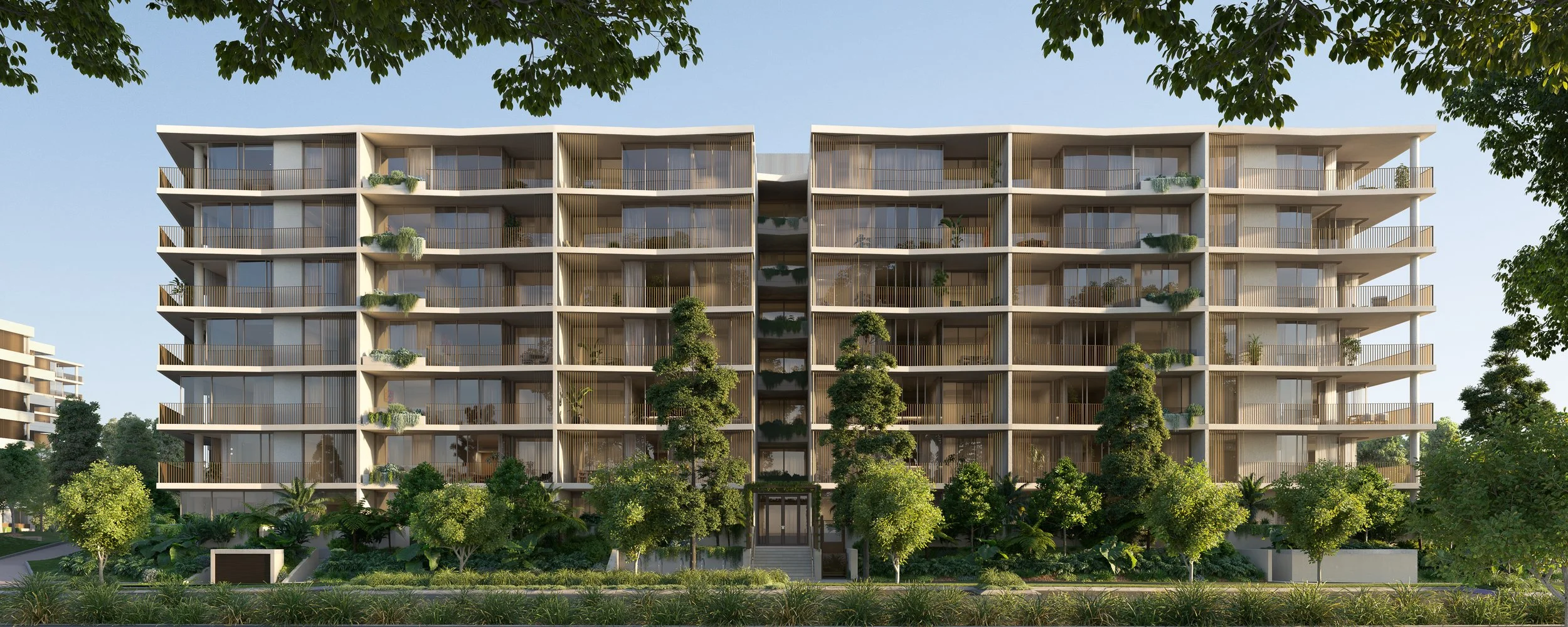 Modern multi-story apartment building with glass windows and balconies, surrounded by lush green trees and landscaping.