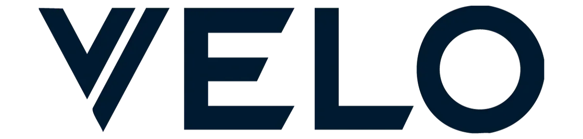 Close-up of the word 'VELO' in bold, dark blue letters with a stylized 'V' resembling a check mark.