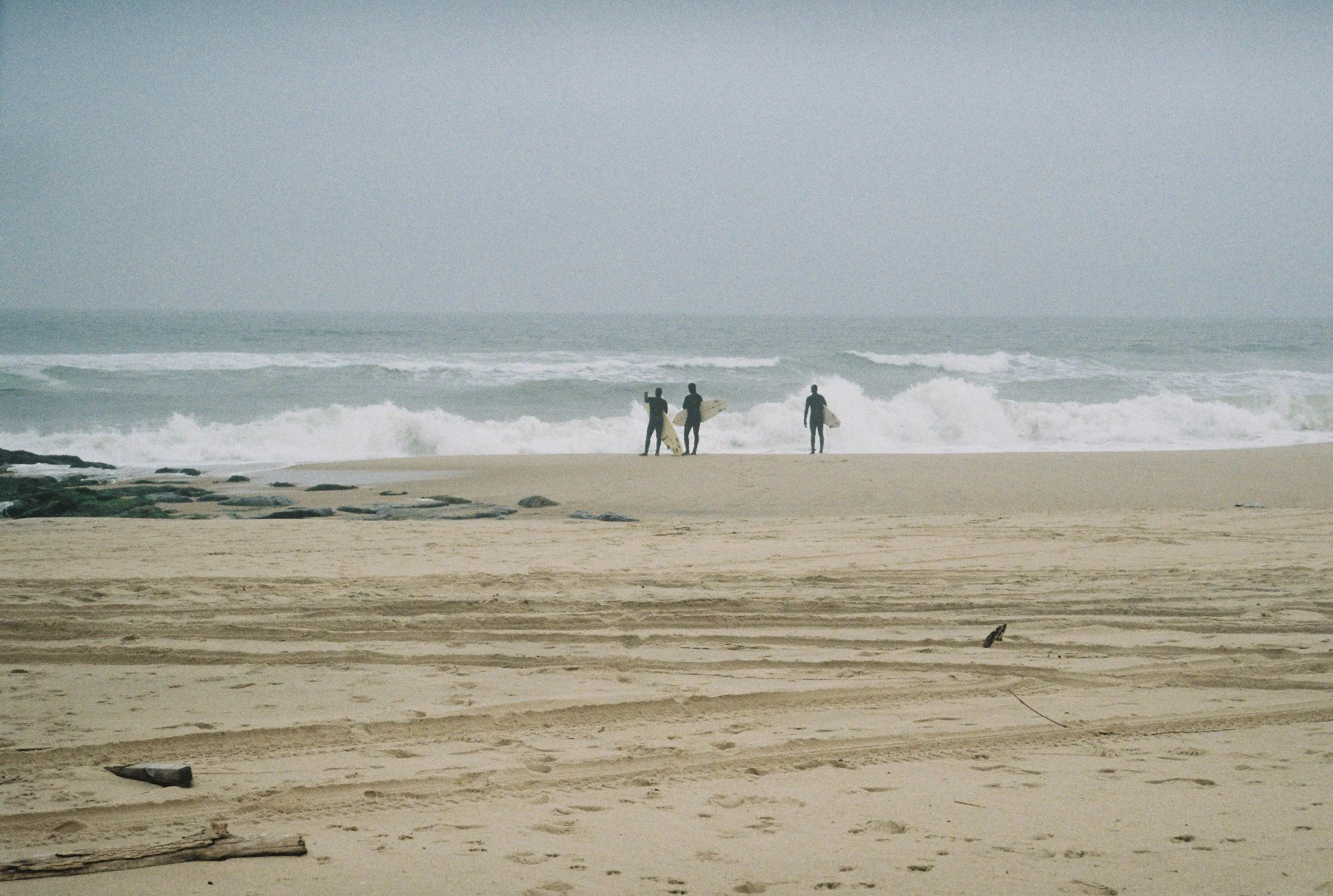 surfers talking at georgica beach