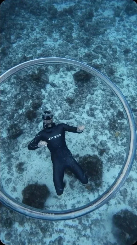 Freediving coach Jimmy Jeantot inside a bubble ring underwater at Camotes Freediving, Philippines. Video still by Thomas Dohm.