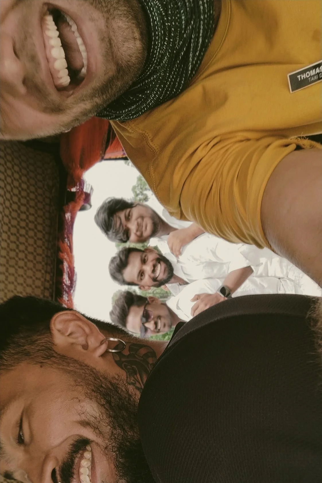 Thomas Dohm and Nicholas Hon during the Happy Cab tuk-tuk campaign across India, with three young men on a motorcycle who threw their phone for a selfie. Mental health campaign with NGO Sangath, 2023