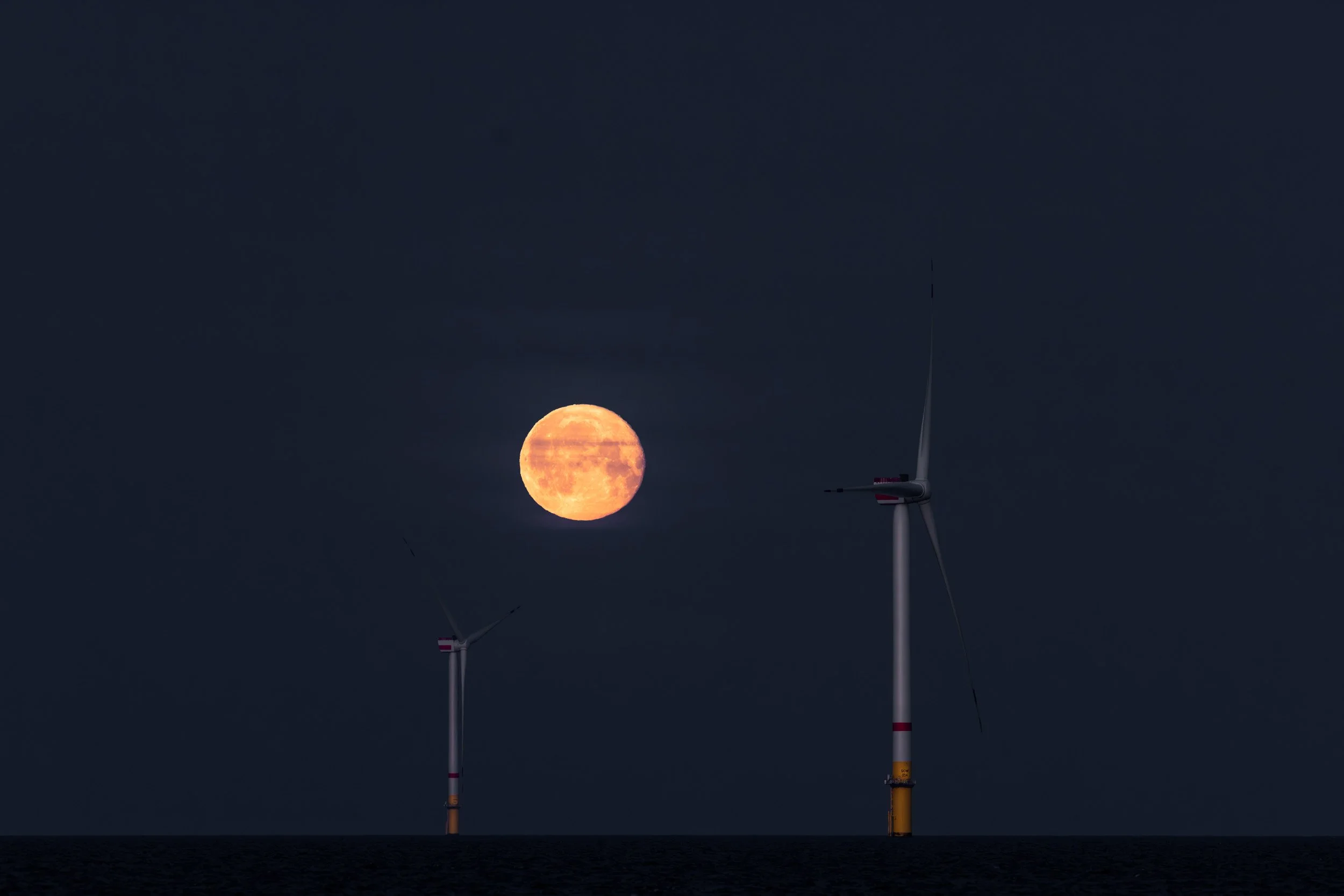 Moon over an offshore wind farm in the North Sea