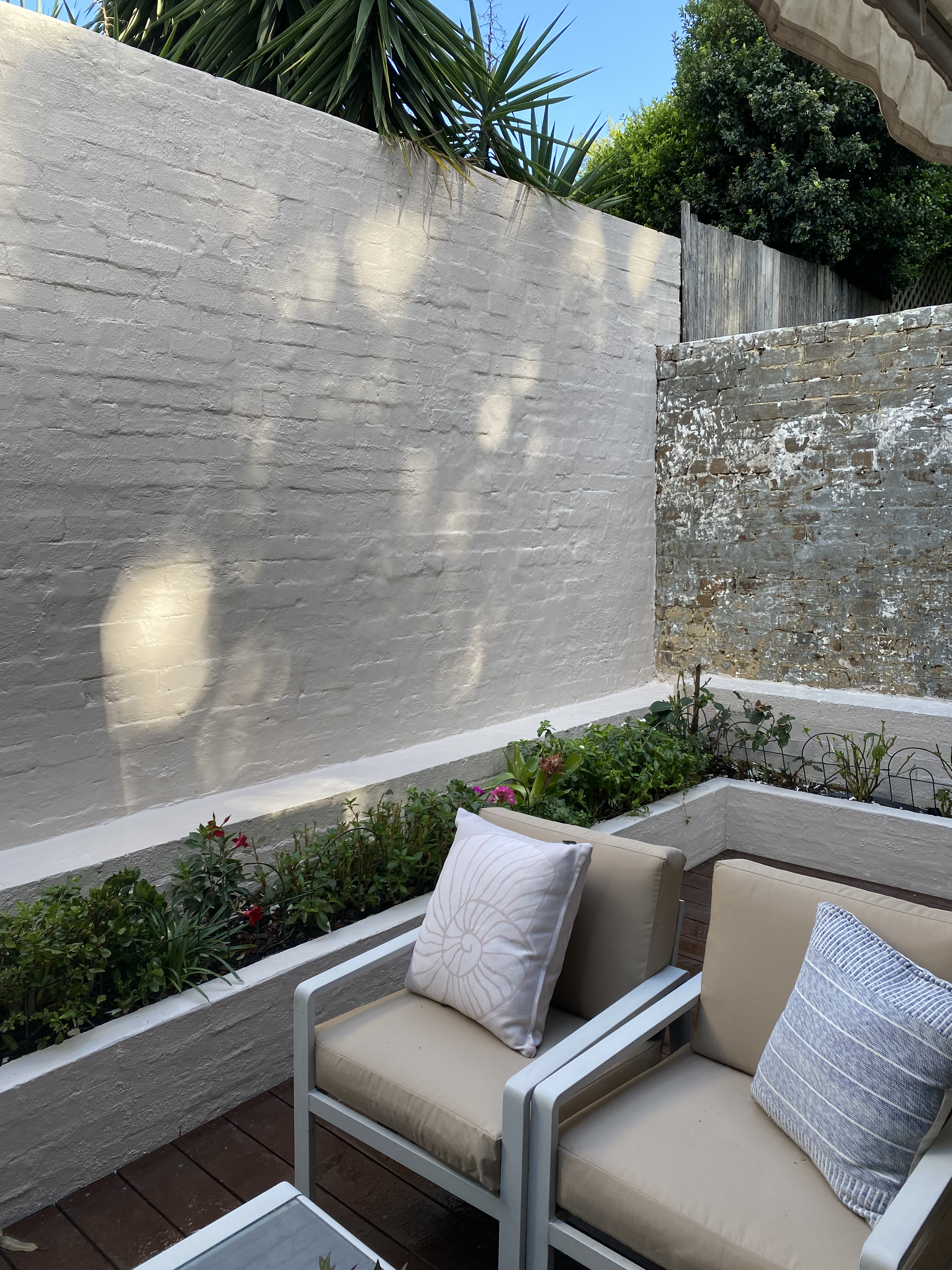 Exterior wall painting for Sydney terrace courtyard with heritage brick detail
