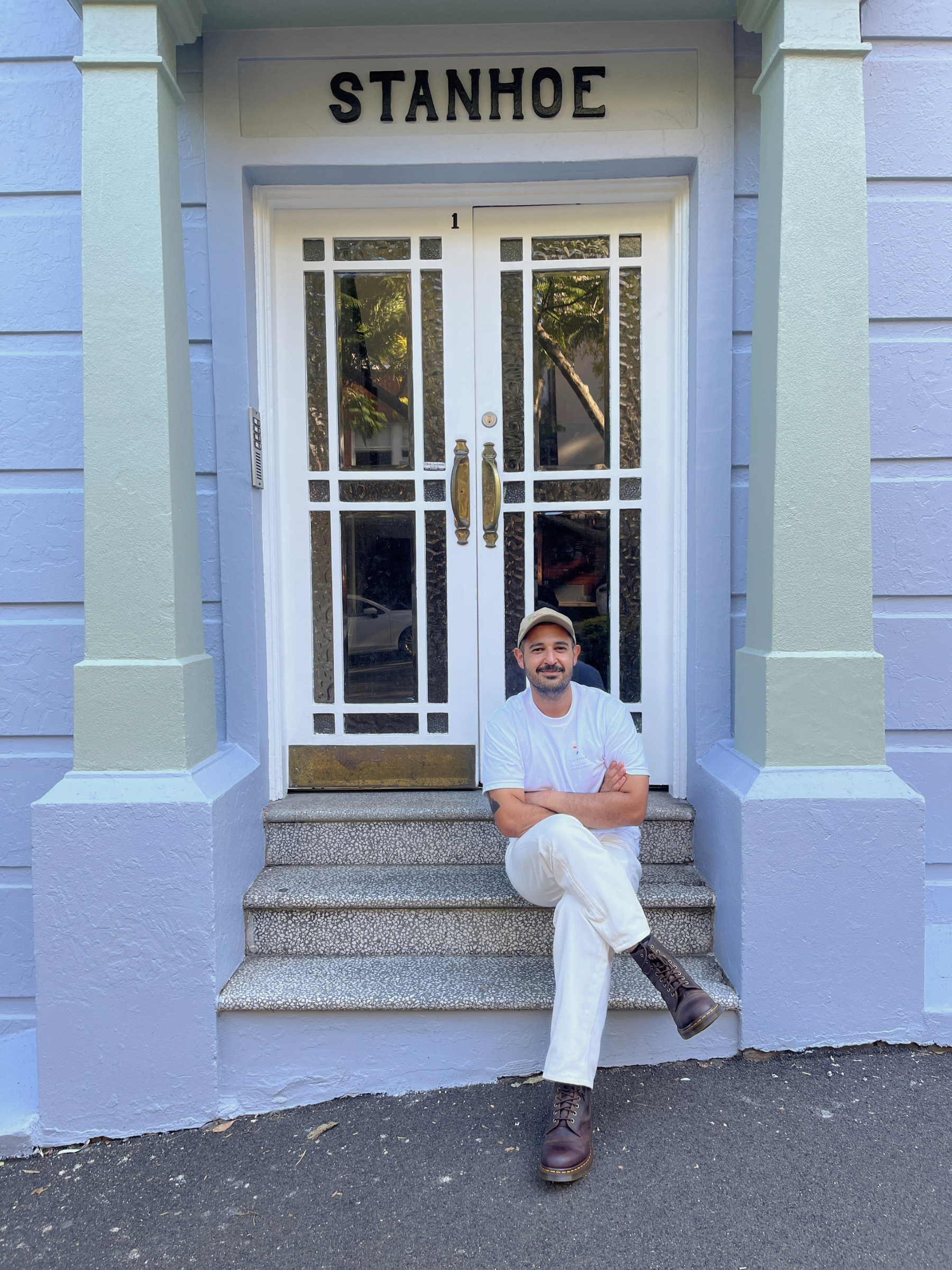 Tom Worxs painter Sydney sitting outside heritage building Stanhoe entrance