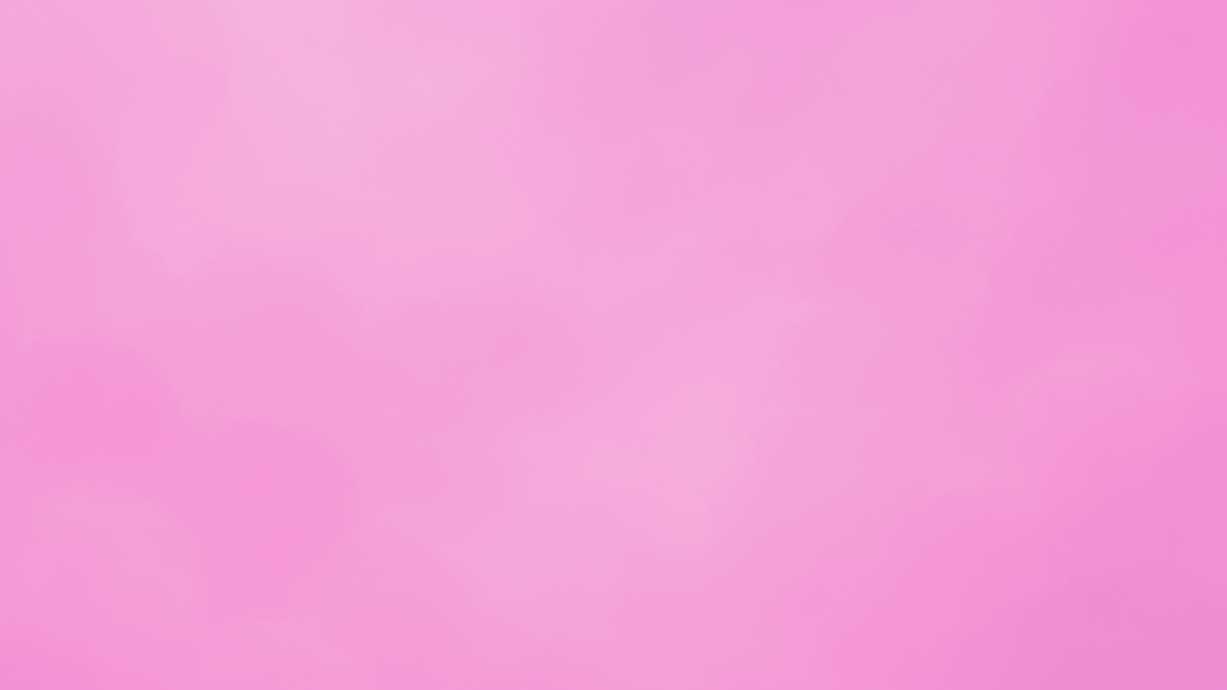a pink gradient background with no distinguishable objects or features.