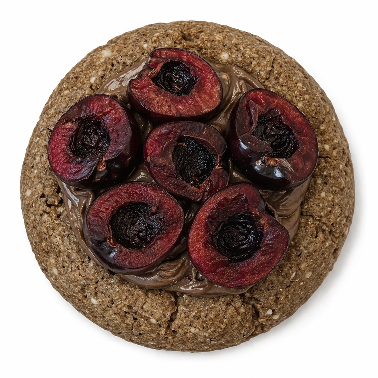A cookie with a crumbly, oat and nut texture, topped with a layer of chocolate spread and arranged halved cherries.