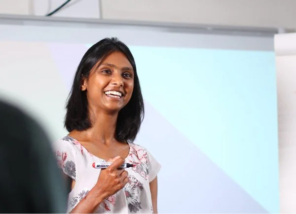 Thirtyone-eight - woman at work with whiteboard.jpg