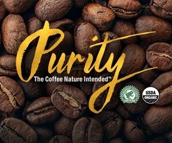Close-up of roasted coffee beans with text 'Purity' and tagline 'The Coffee Nature Intended', USDA Organic logo.