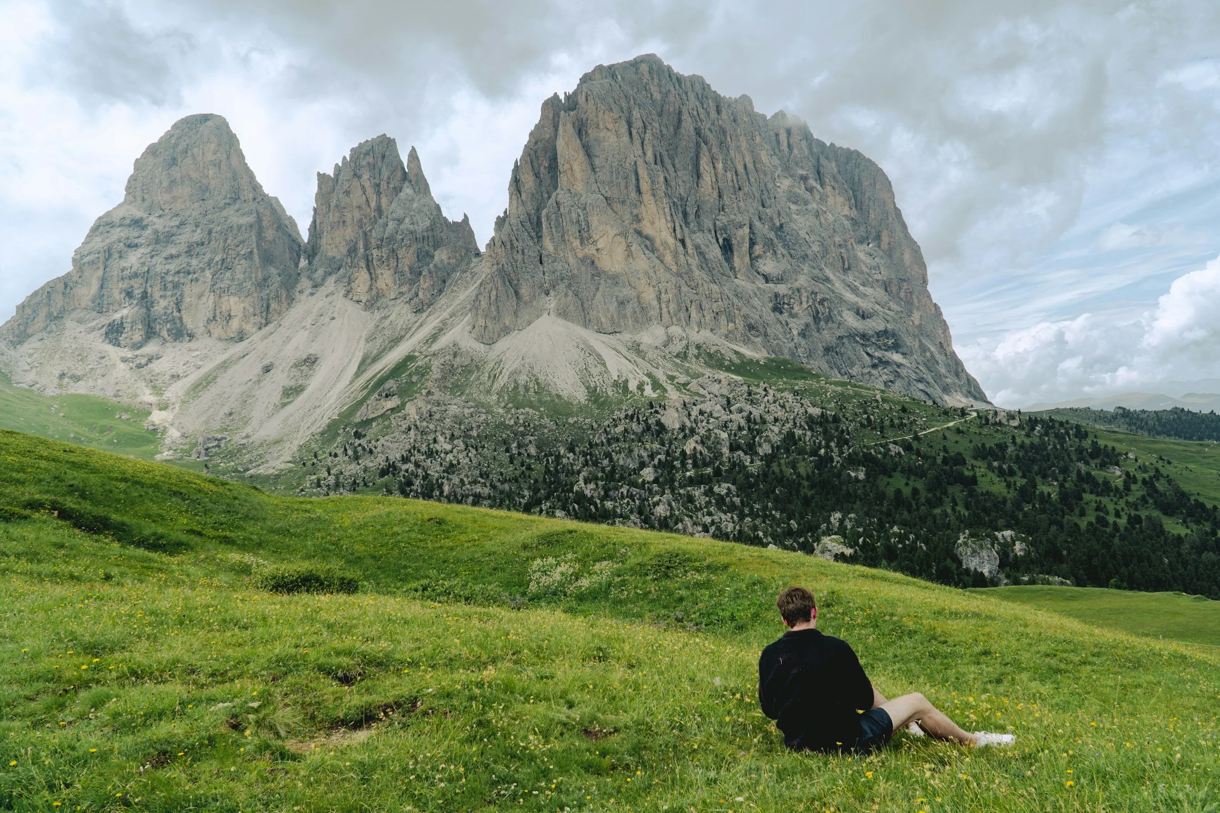 Persona relaxing in a field in soft natural light