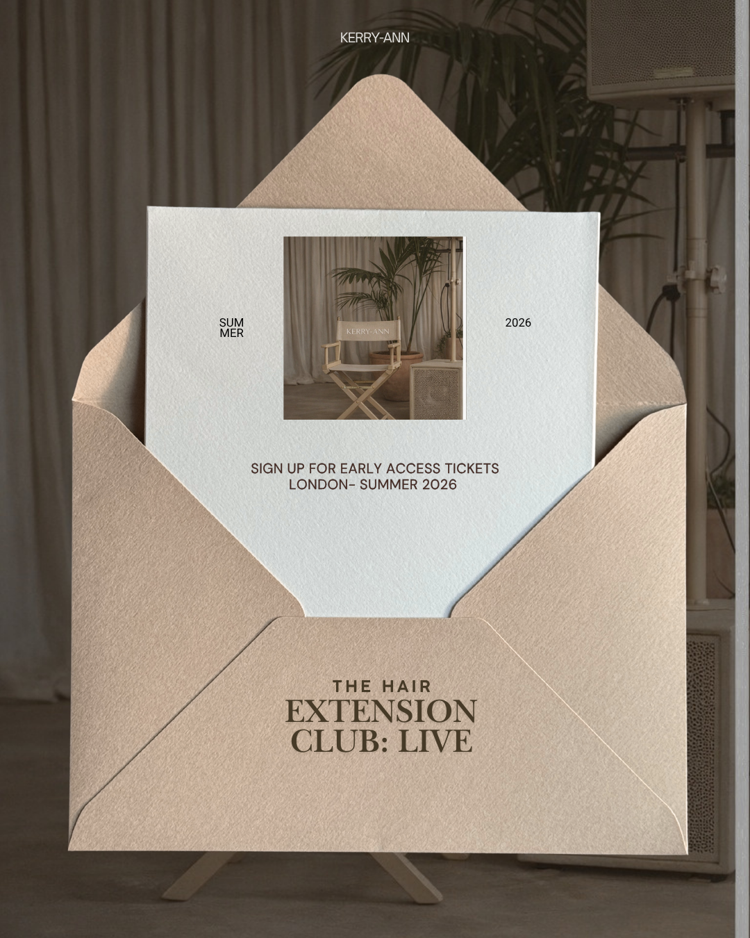 Invitation or flyer for a hair extension club event, featuring a beige envelope, a white card with a photo of a director's chair labeled 'KERRY-ANN,' potted plants, and text about early access tickets for a London summer 2026 event.