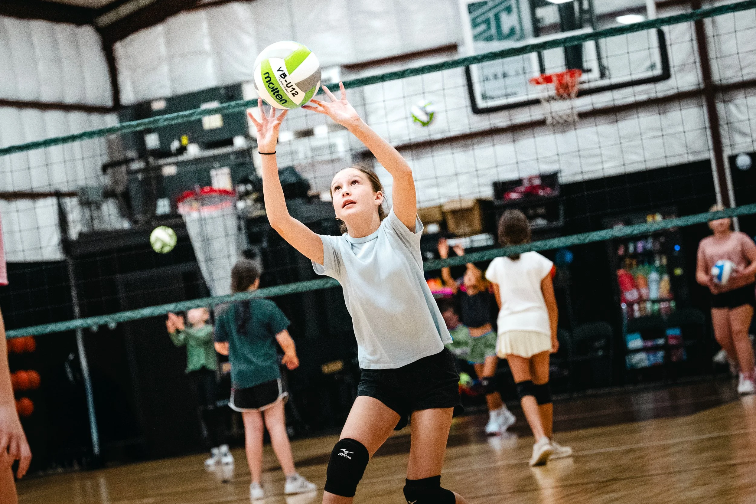 Young athlete practicing volleyball setting during clinic at Dripping Springs Sports Club