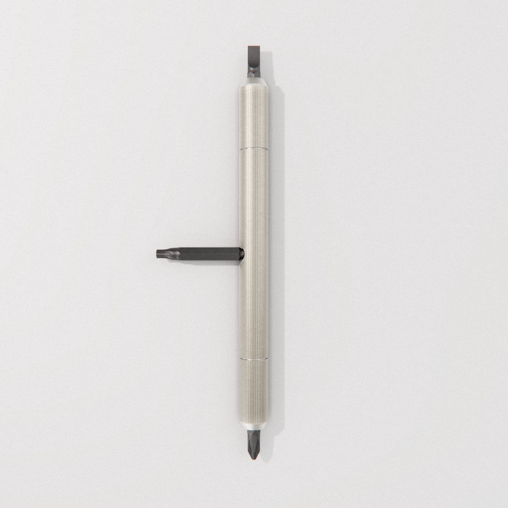 a precision screwdriver with a knurled metallic handle and flat-head tip on a light background.