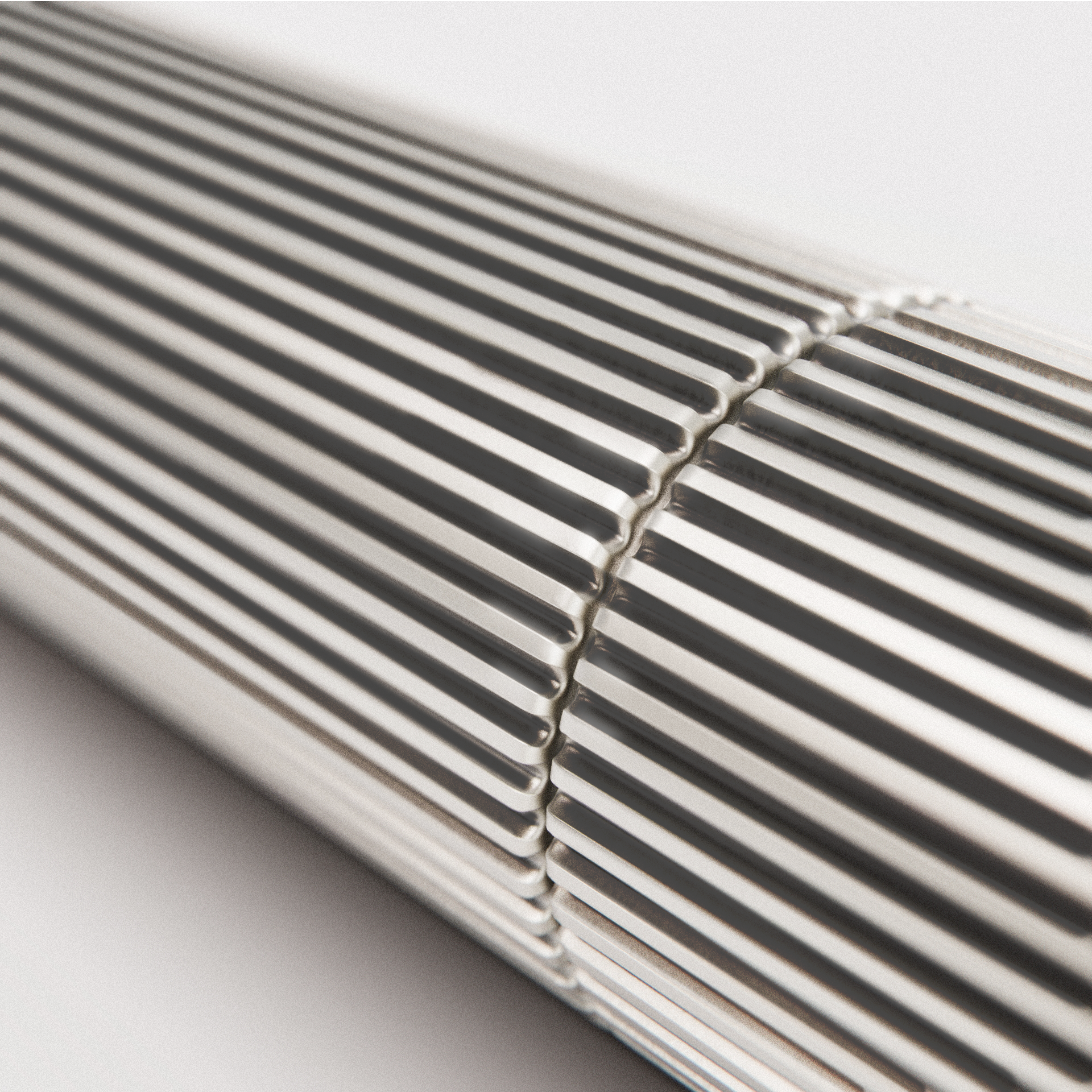 a precision screwdriver with a knurled metallic handle and flat-head tip on a light background.