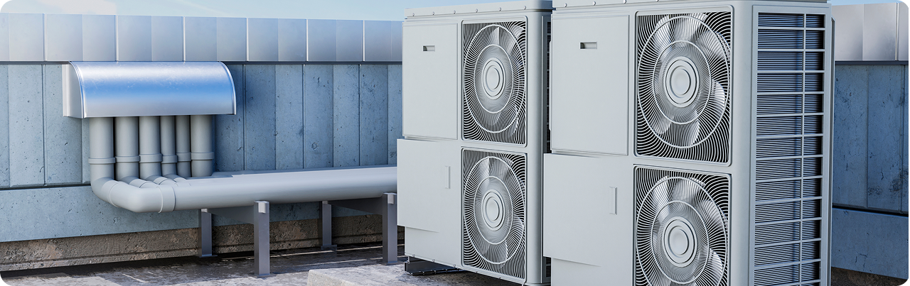 Outdoor HVAC units and ductwork on a building rooftop.