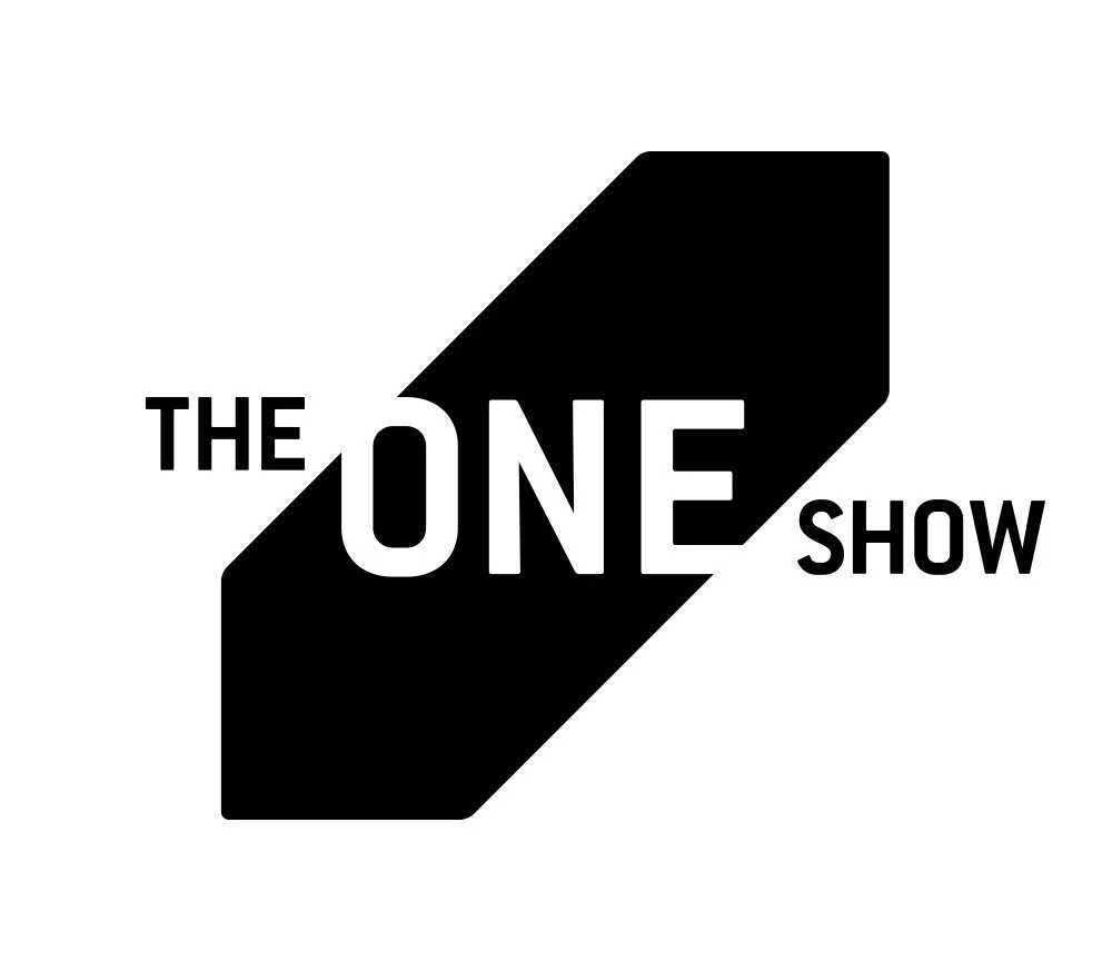 Logo for The One Show featuring bold black and white geometric design with the words 'The' and 'Show' flanking the large word 'One' in the center.
