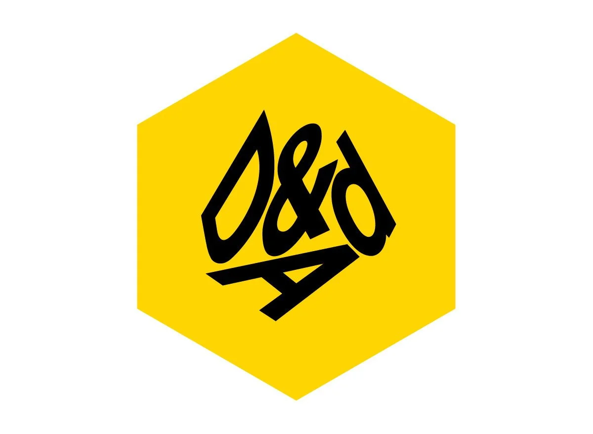 Yellow hexagonal sign with black stylized D&D logo in the center.
