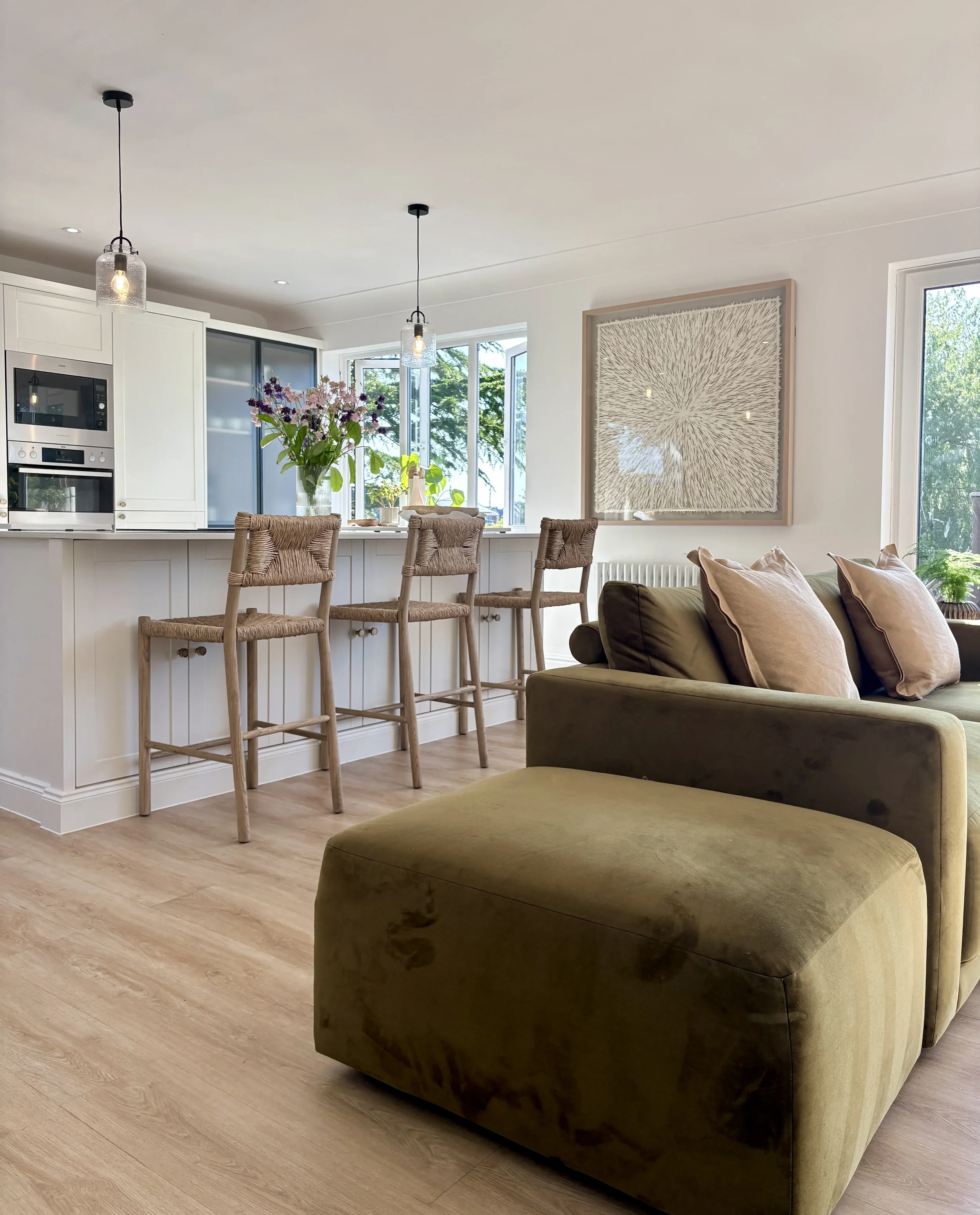 Designed to encourage connection and everyday living, this open-plan kitchen and lounge combines bespoke joinery, natural materials and carefully layered furnishings to create a welcoming and functional family home.