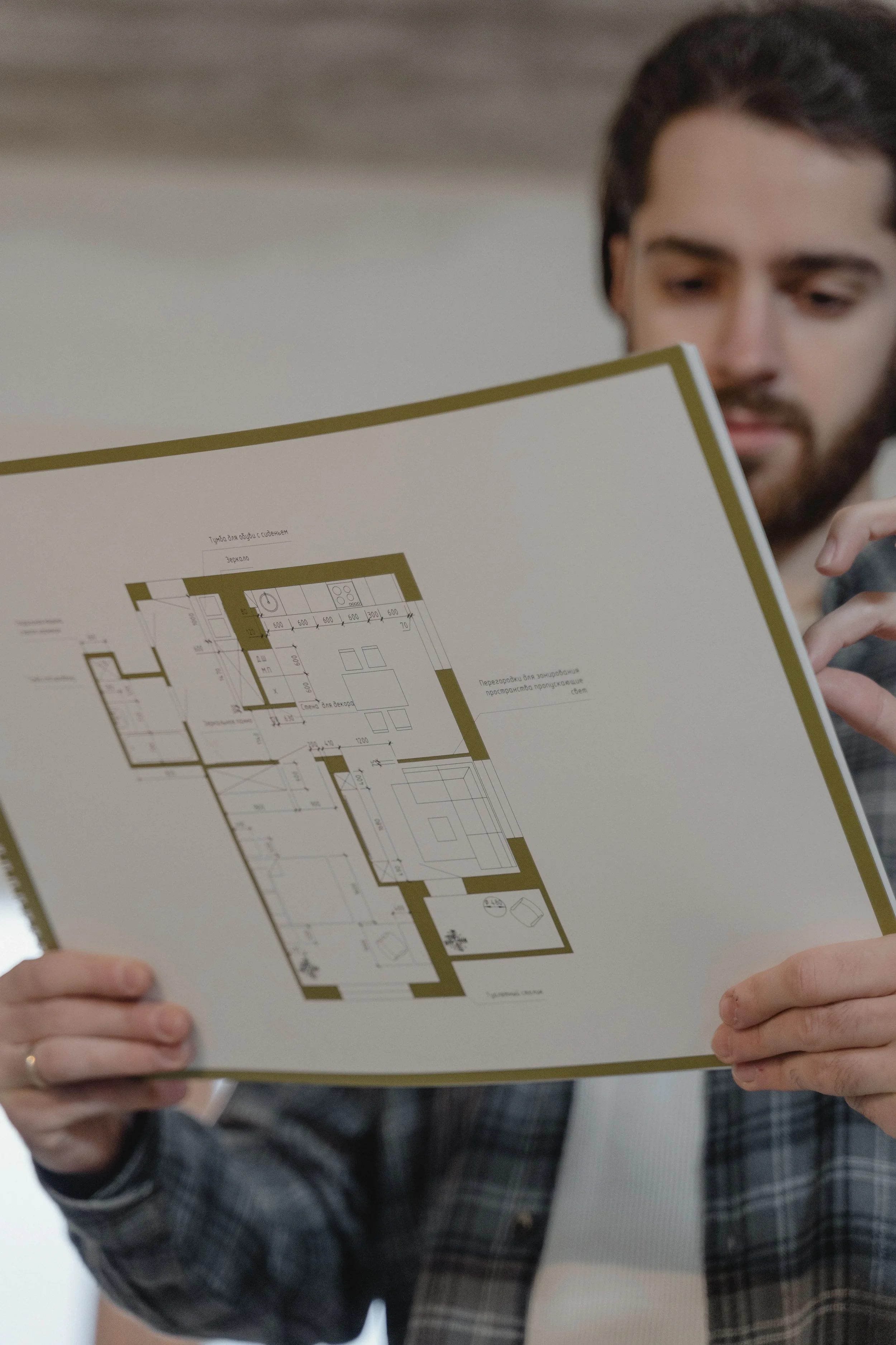 Reviewing architectural floor plans during the design development phase of a residential renovation project, supporting effective project management and spatial planning