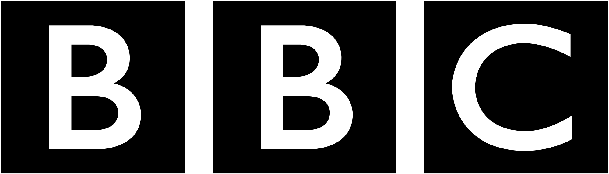 A dark silhouette of a person standing outdoors at night, looking at a cityscape with bright lights.
