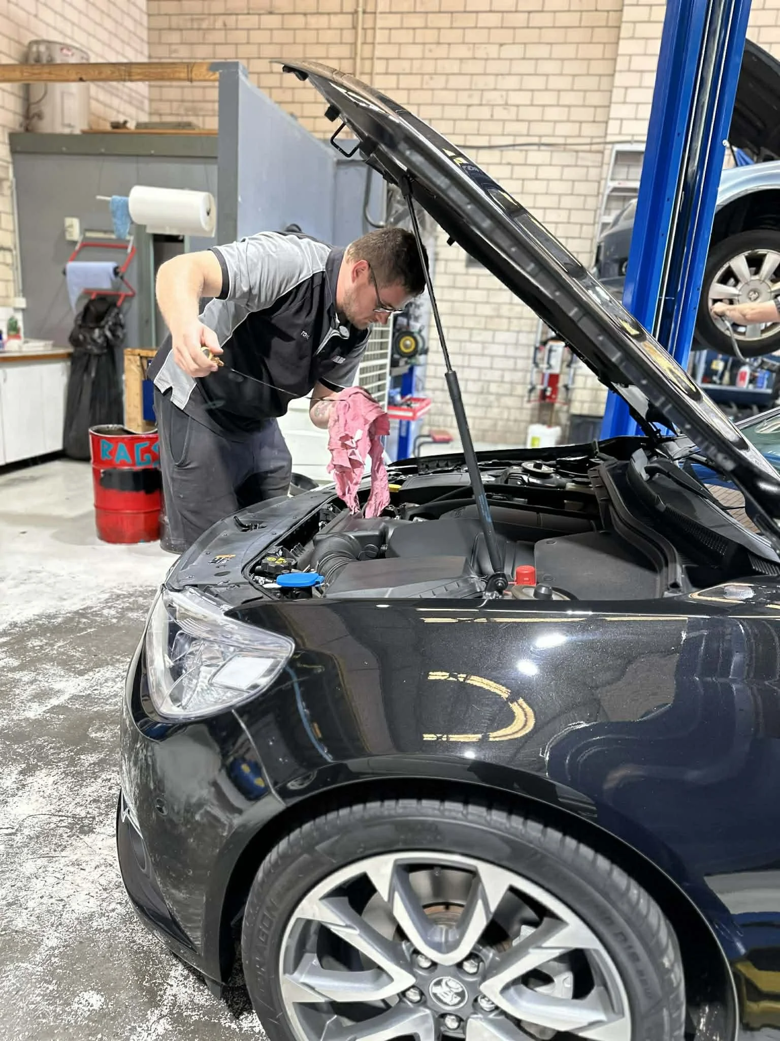 Mechanic carrying out logbook servicing at Jalmac Automotive in Ringwood