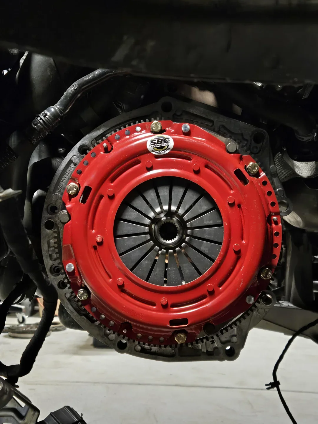 Vehicle clutch repair work being carried out in a workshop