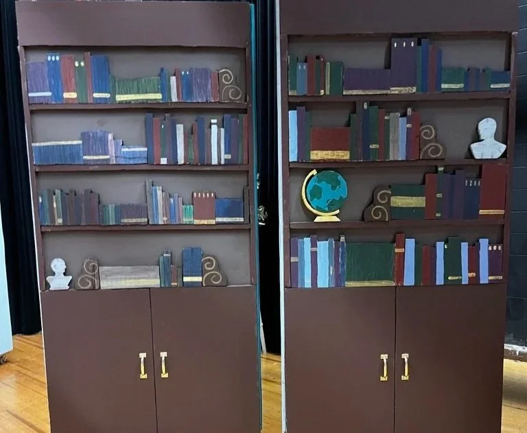 Hand-cut and painted styrofoam bookshelf facades.