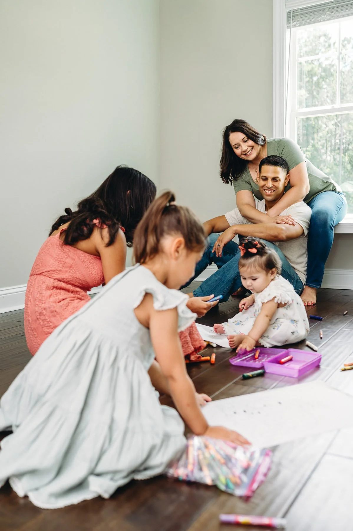 Unposed photo of family coloring together in kids playroom, Bend Family Photography by Elise Souders
