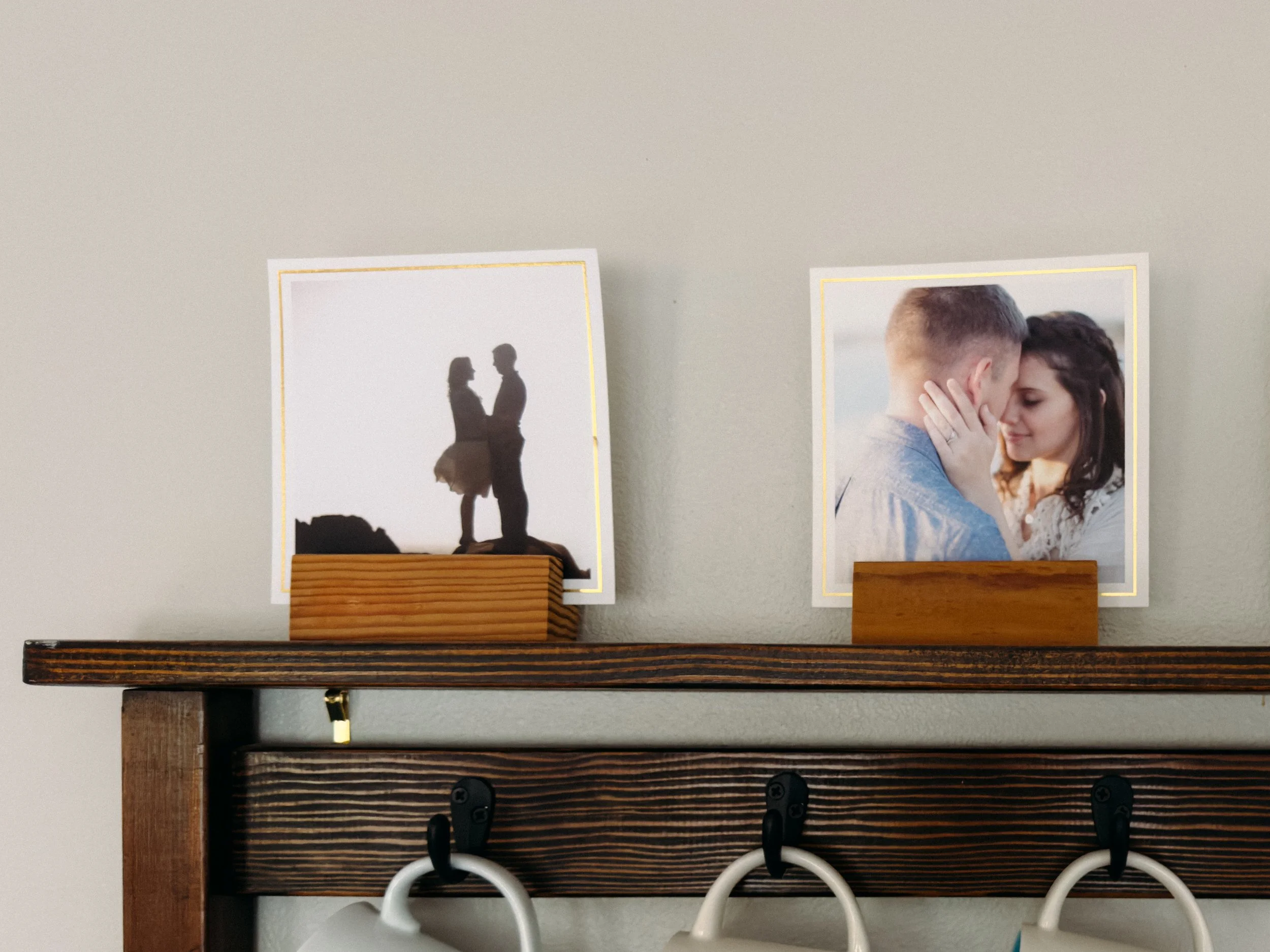 Two 5x5" square photo prints displayed in wood holders.