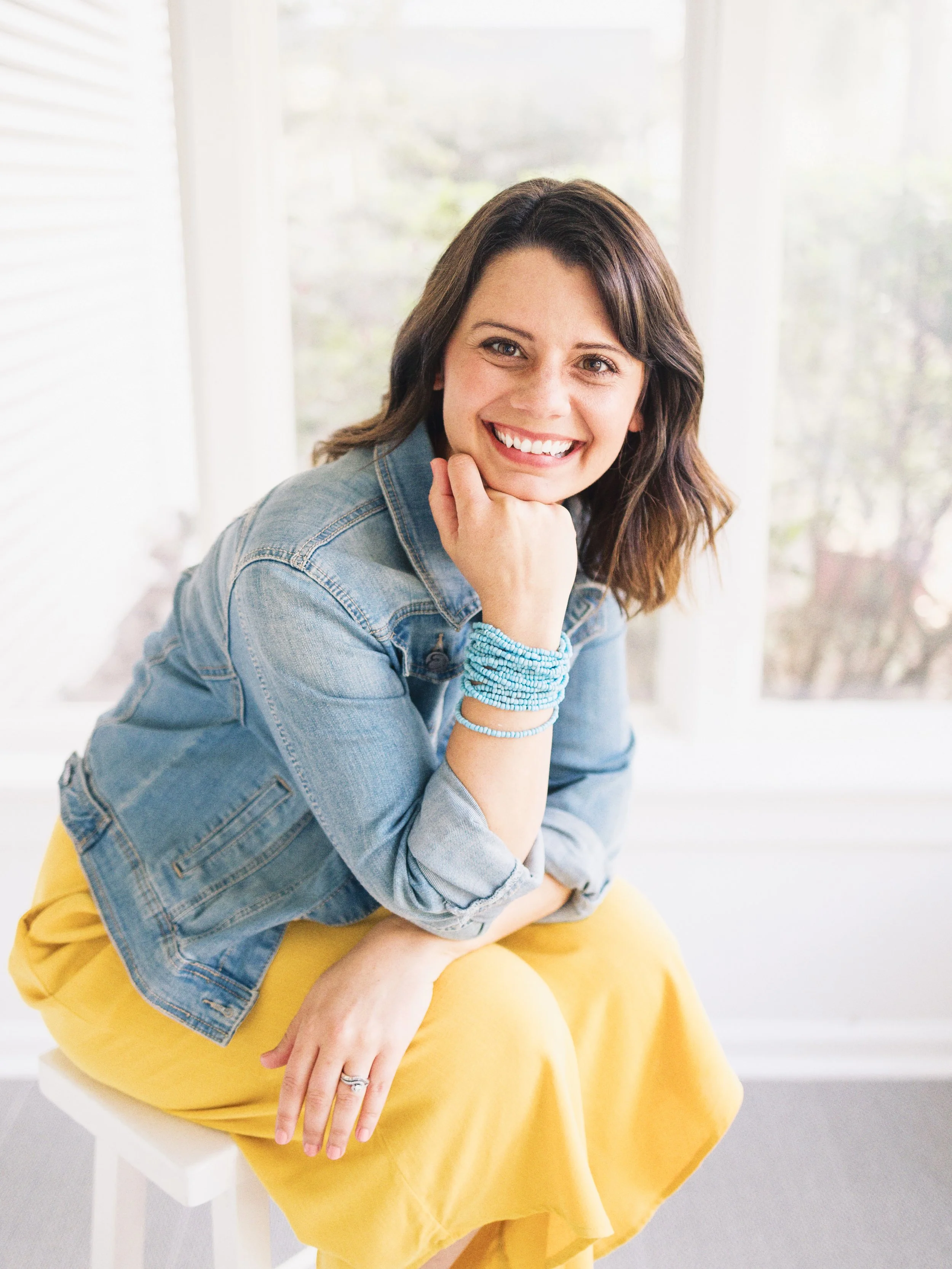 Portrait of Elise Souders, Bend Oregon Photographer, wearing a yellow dress.