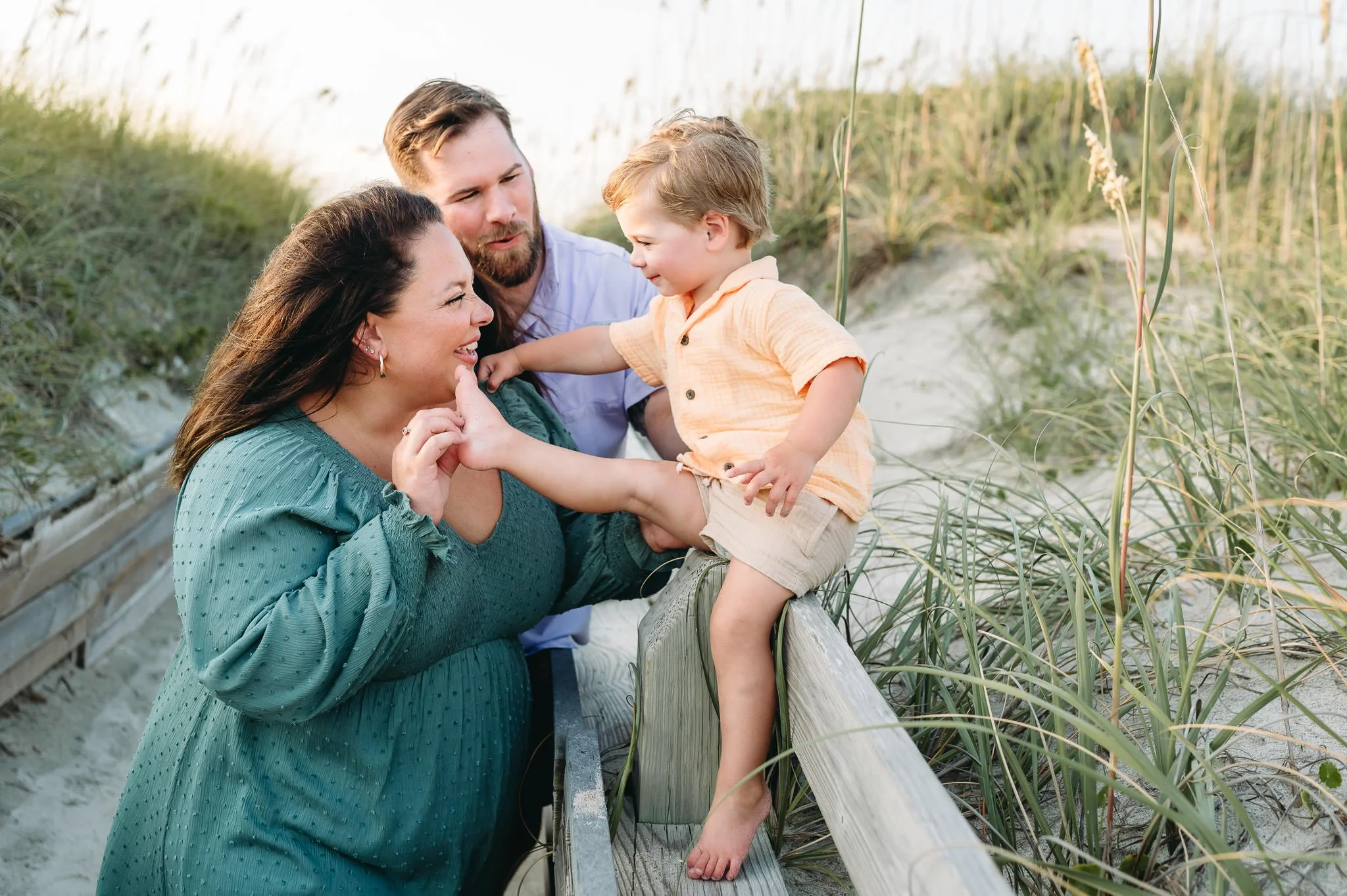 Candid portrait of family tickling toddler toes by Elise Souders, Bend Oregon Photographer