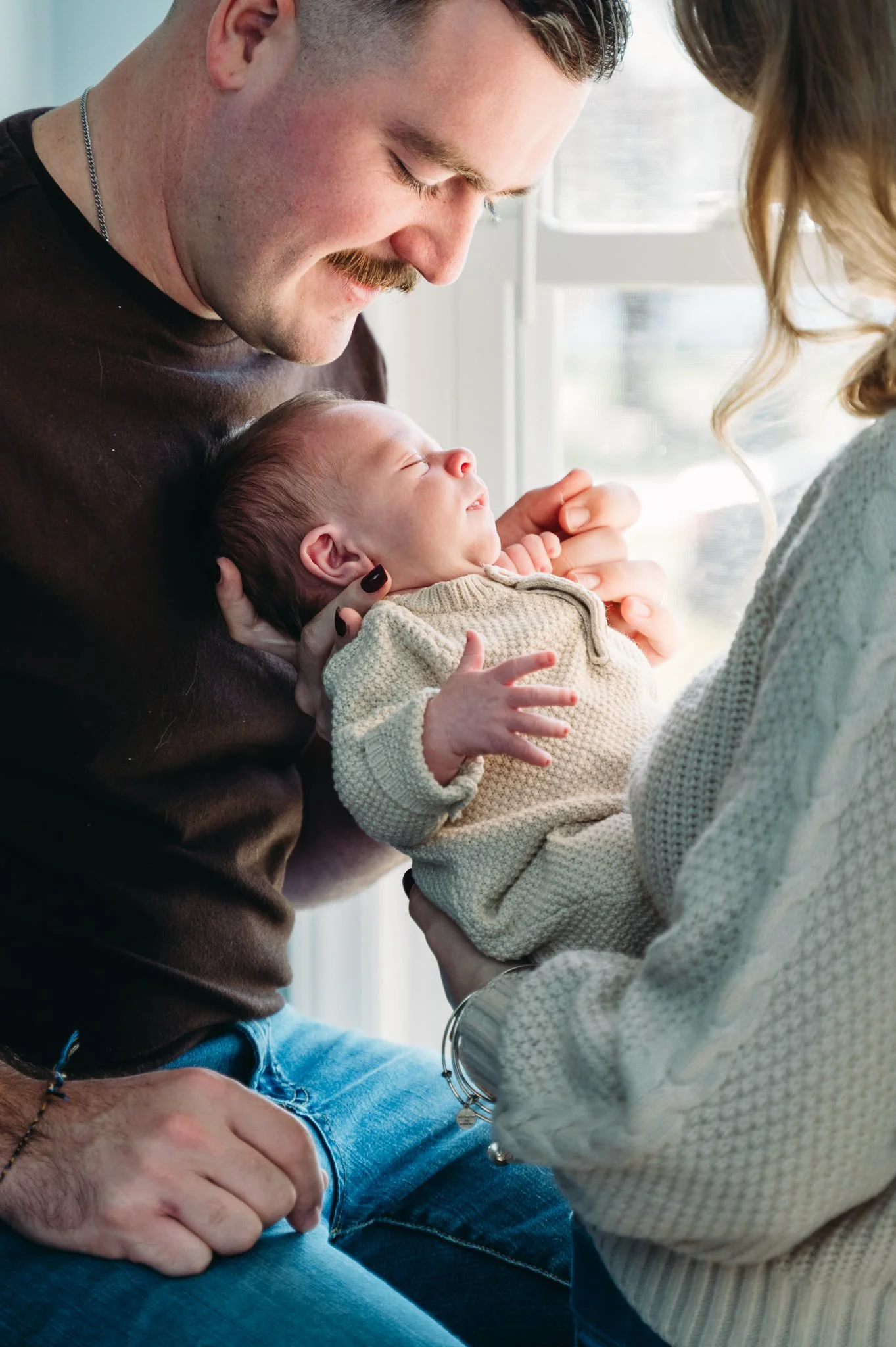Mother and father with baby, in-home newborn photography, Elise Souders, photographer