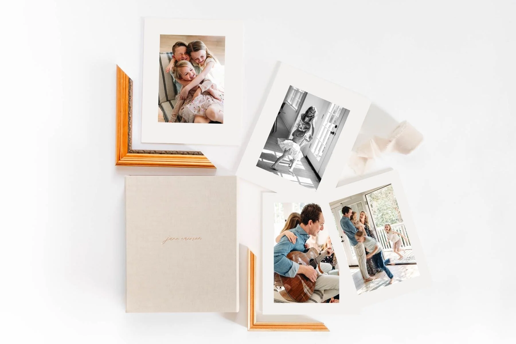 Examples of professional photo prints laid out on a white surface with matts and frames.