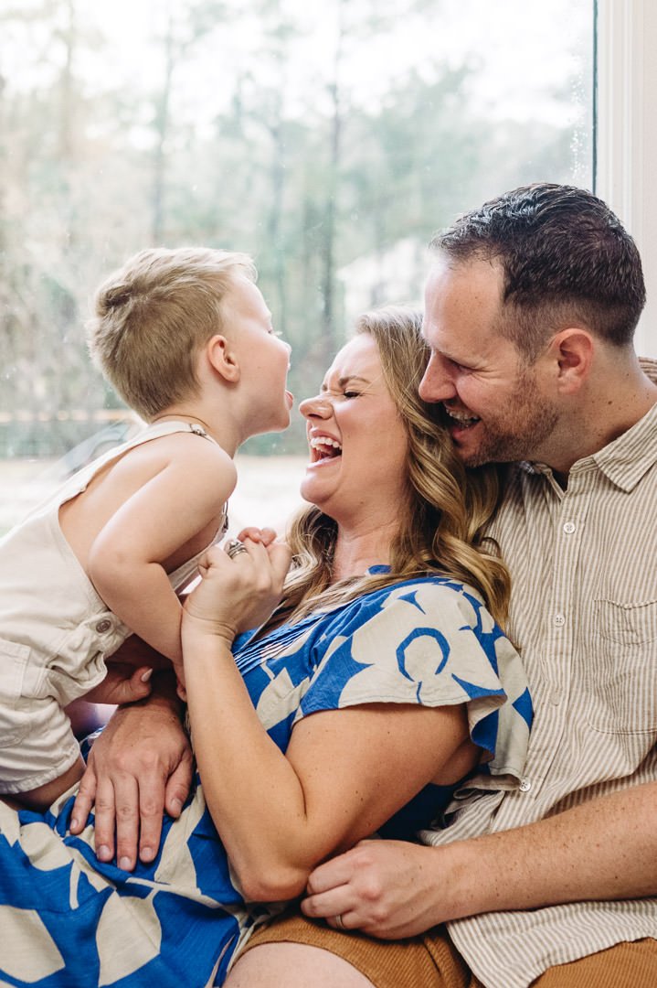 lifestyle image of family laughing together in their home, by Elise Souders, Bend, Oregon photographer