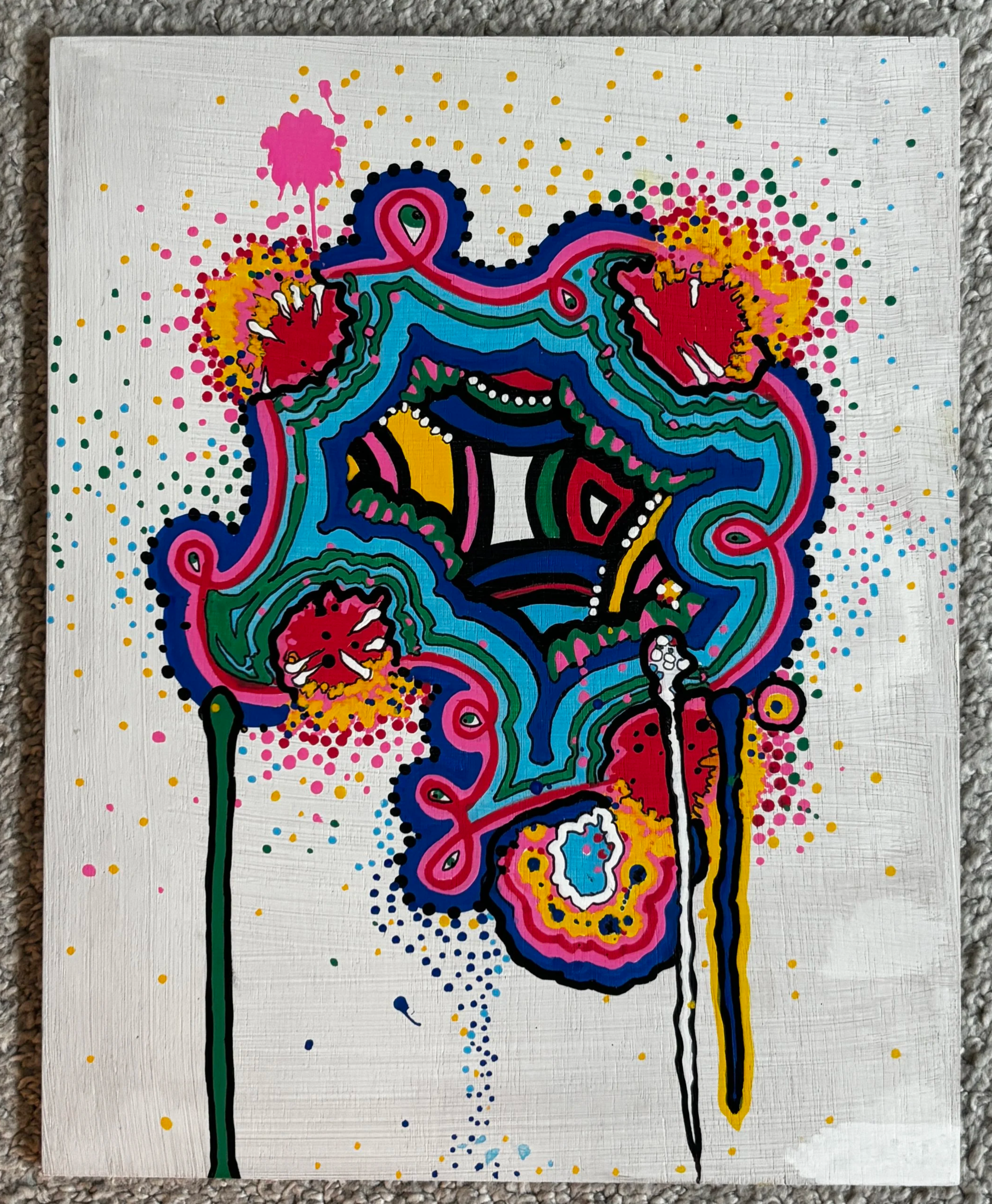Abstract art featuring dots and drips and layered Mondrian primary colors inside of an organic amoeba-type figure.