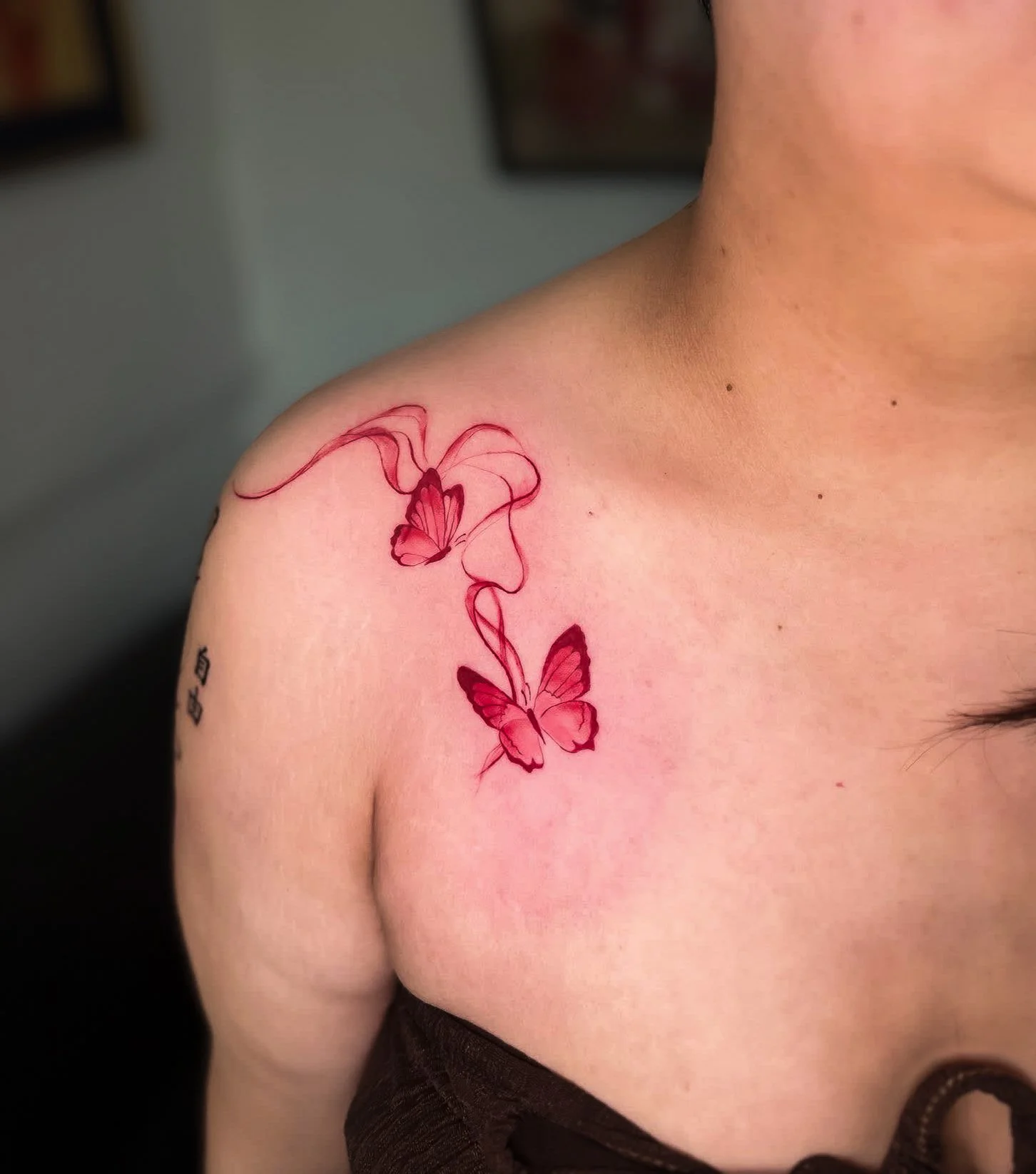 Fine line butterfly tattoo by Let’s Tatt Studio Chiang Mai