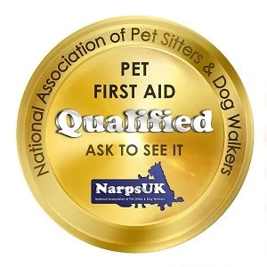 Gold badge with black and white text for the National Association of Pet Sitters & Dog Walkers. It reads "PET FIRST AID Qualified ASK TO SEE IT" and includes a blue logo of NARPS UK with an outline of the UK map.