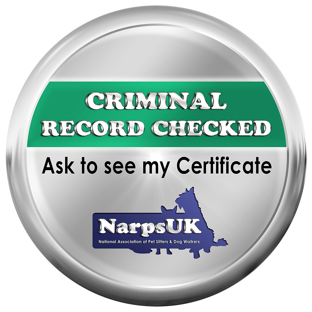 Circular badge with silver border, green and white background, and text indicating a criminal record check, including a call to see the certificate, with a logo of NarpsUK at the bottom.