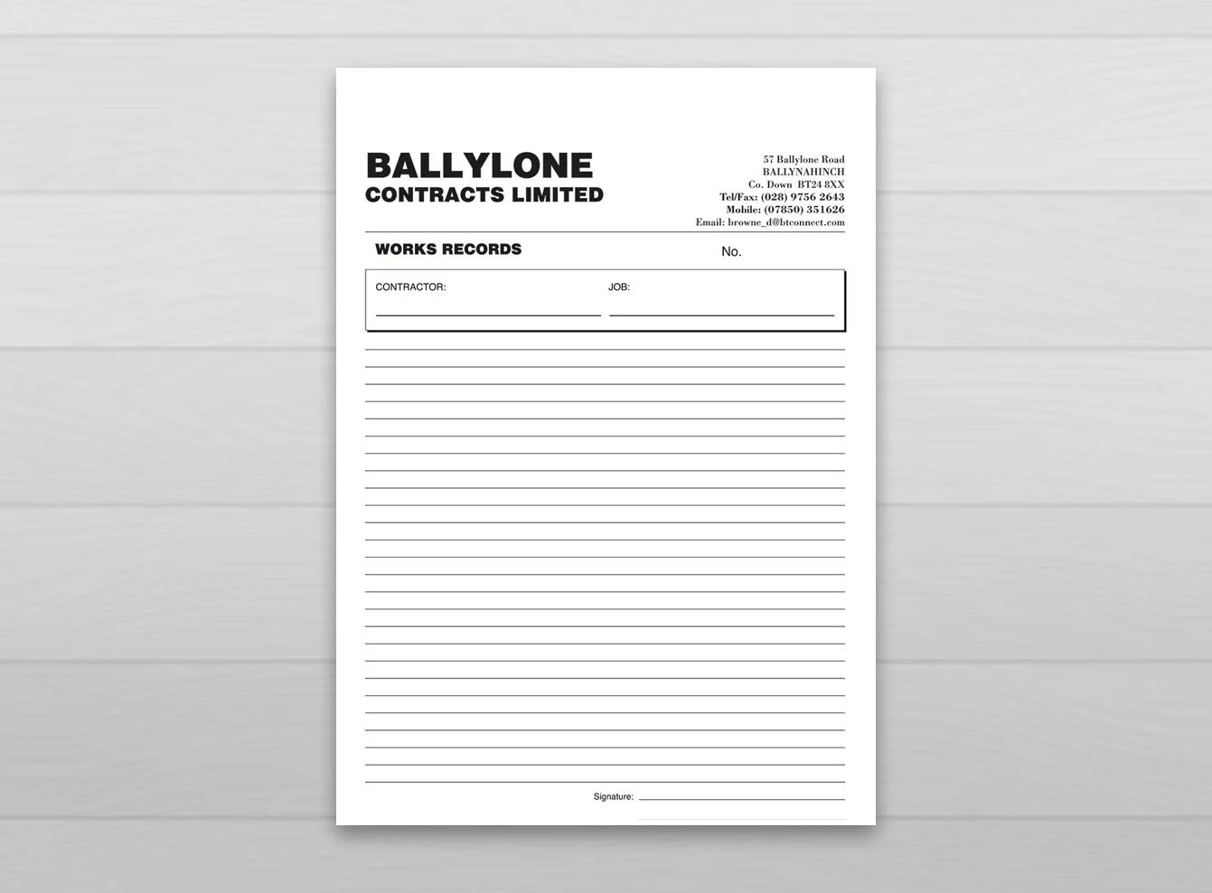 A5 NCR pads with the business name and logo printed onto each page for a business in Ballynahinch.
