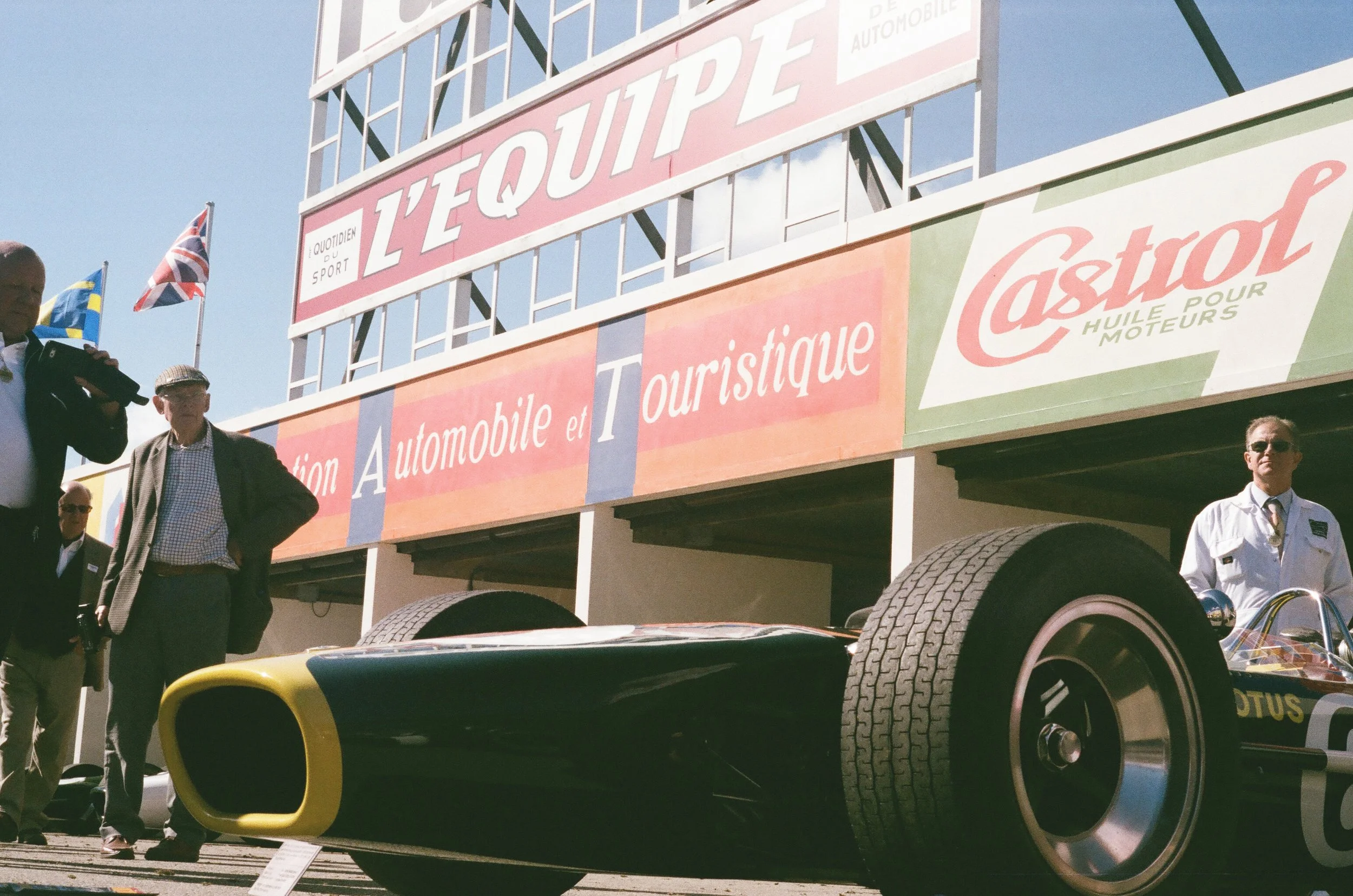 People standing near a Lotus at the Goodwood Revival