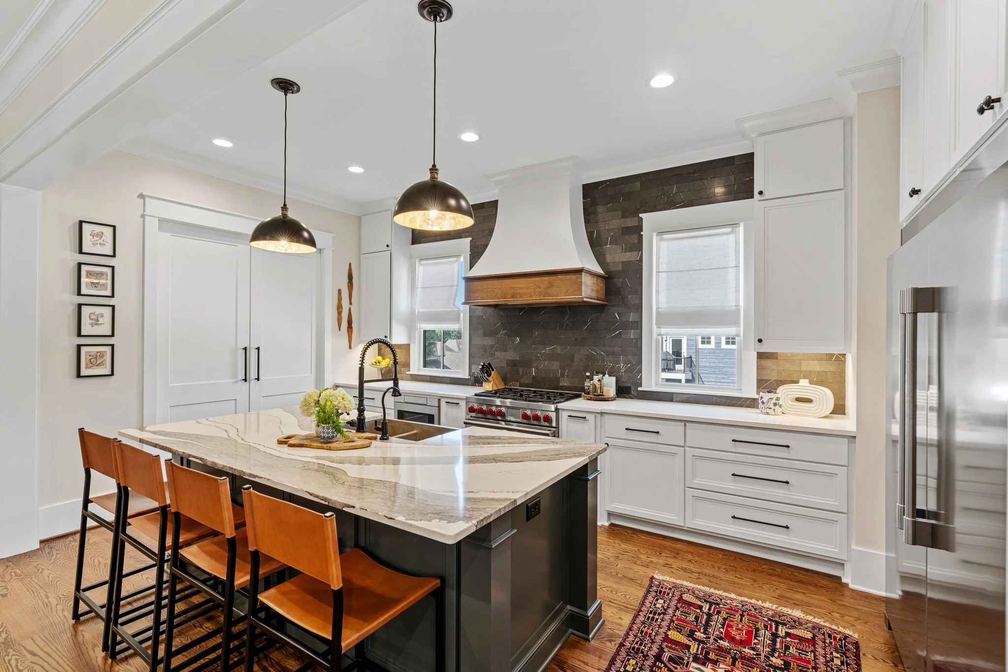 custom home kitchen design with white cabinets and grey and white granite in greenville
