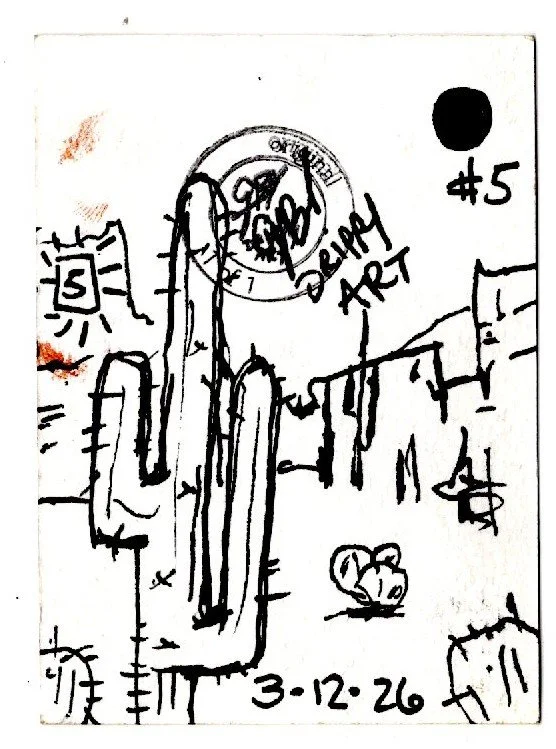 A hand-drawn sketch of a city skyline with tall buildings and a prominent mountain or cliff in the foreground. There is a sun in the upper left corner, the words "Drawing Art" and a date "3-12-26" at the bottom. A black dot and the number "5" are in 