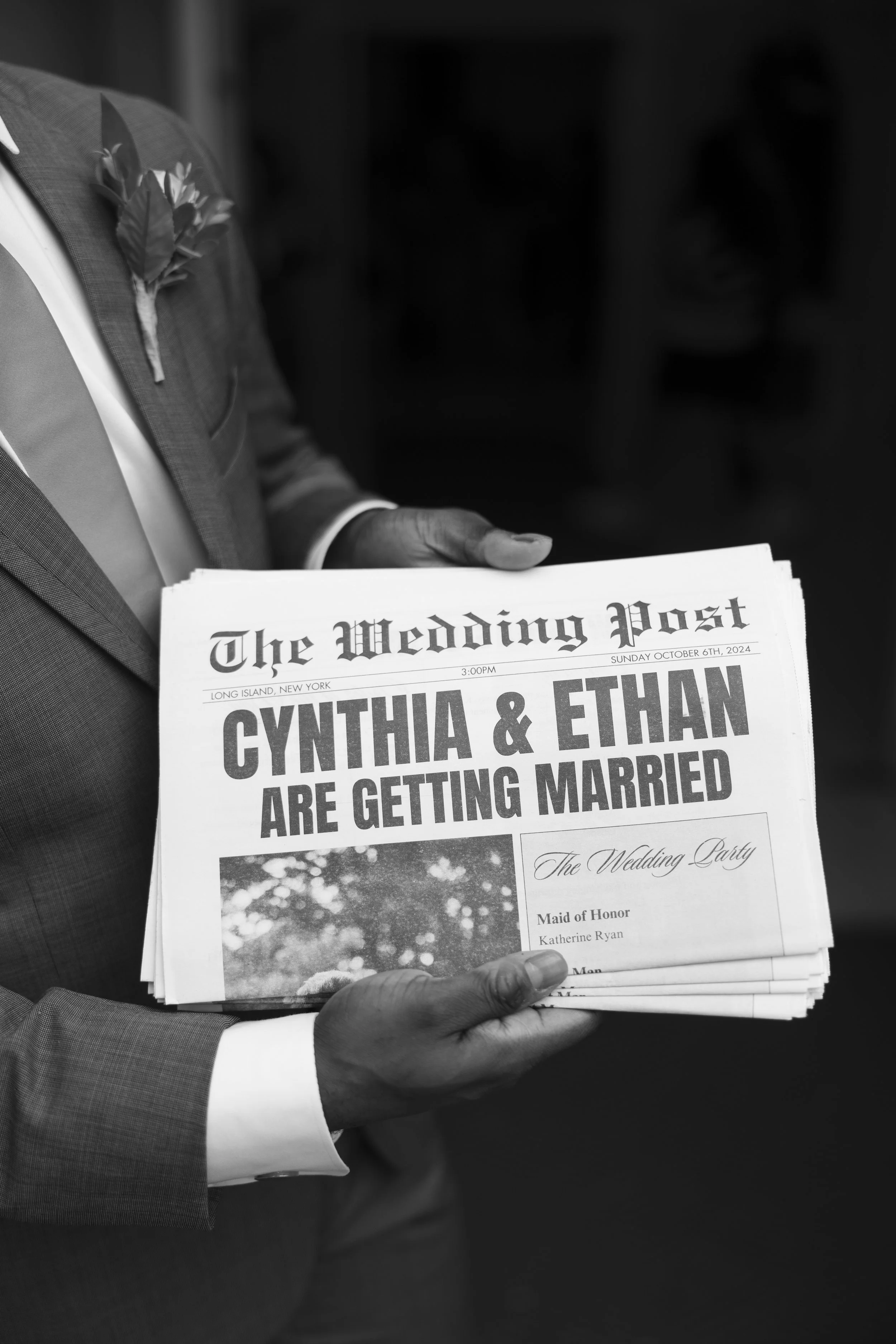 A person in a suit holding a newspaper with a headline announcing the marriage of Cynthia and Ethan. wedding program.