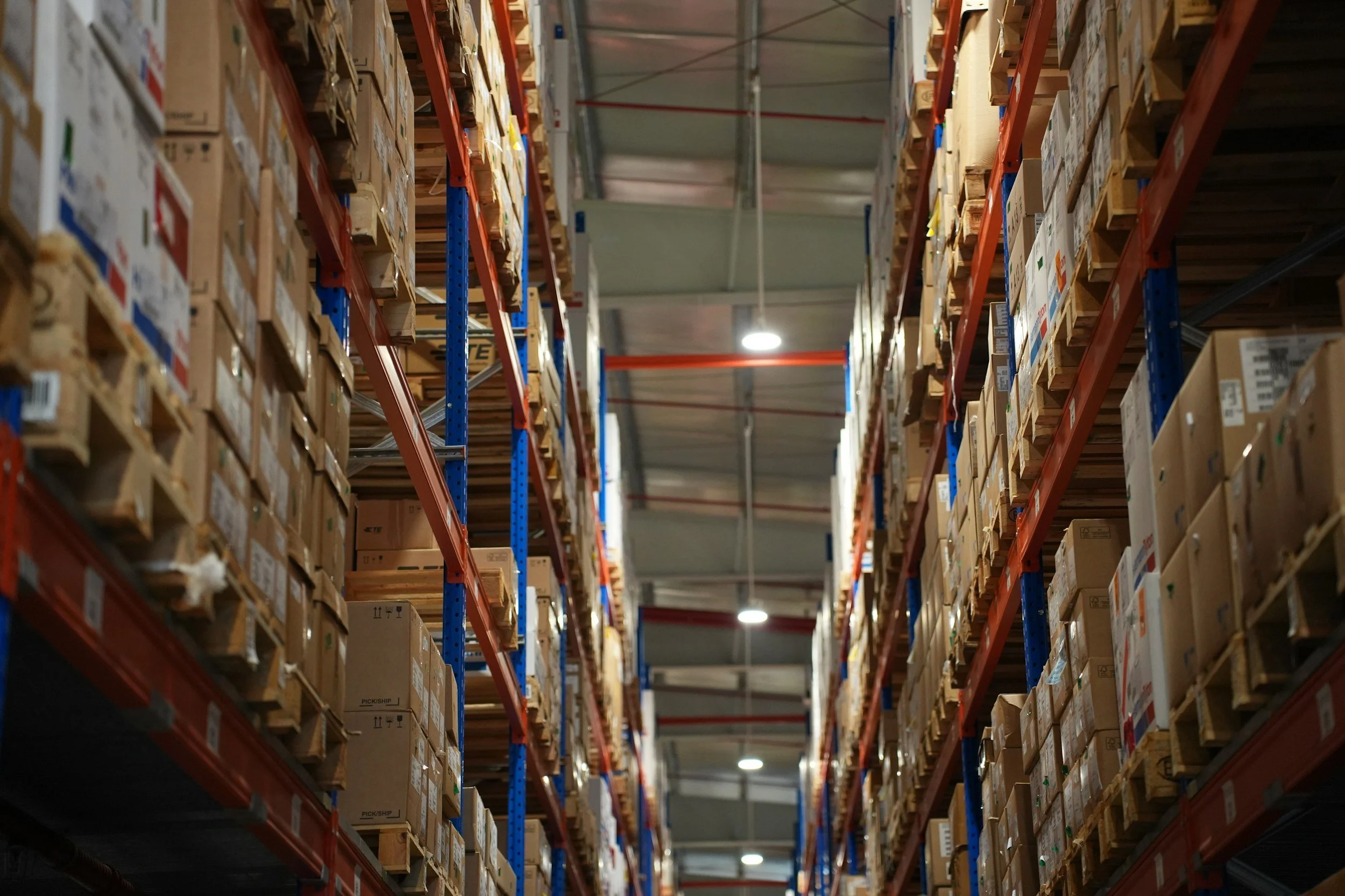 Boxes stacked neatly on shelves inside a retail store or warehouse