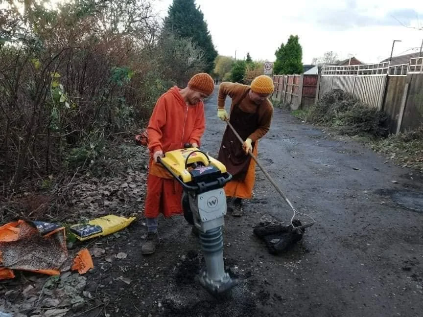 Monks fixing road.jpg