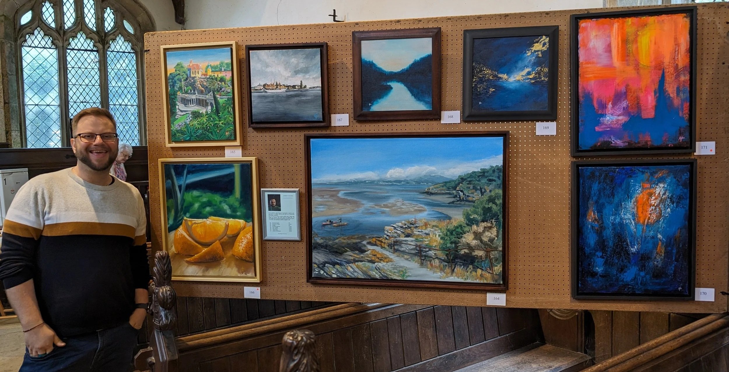 Me with a selection of my paintings in the Marshchapel exhibition