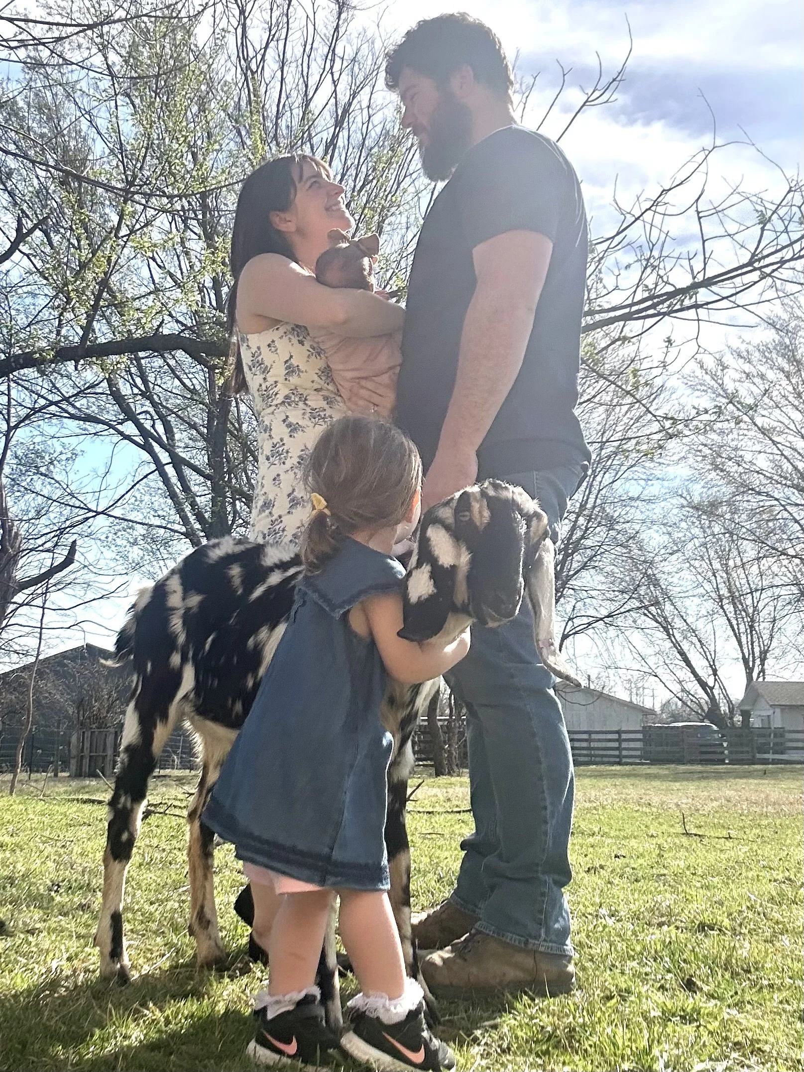 A family outdoors on a sunny day