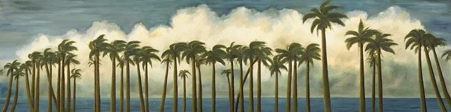 A row of palm trees along a shoreline with ocean and cloudy sky in the background.